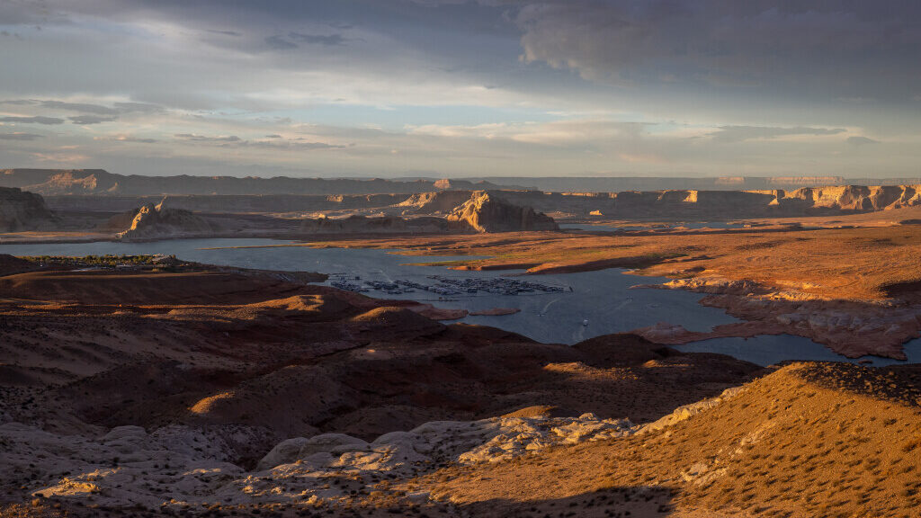 The Wahweap Marina and parts of Lake Powell in Arizona, foreground, and Utah, background, are pictu...