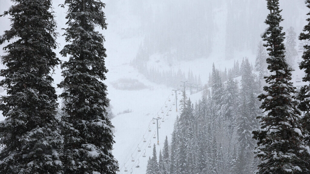 A ski lift travels through Snowbird Ski Resort....