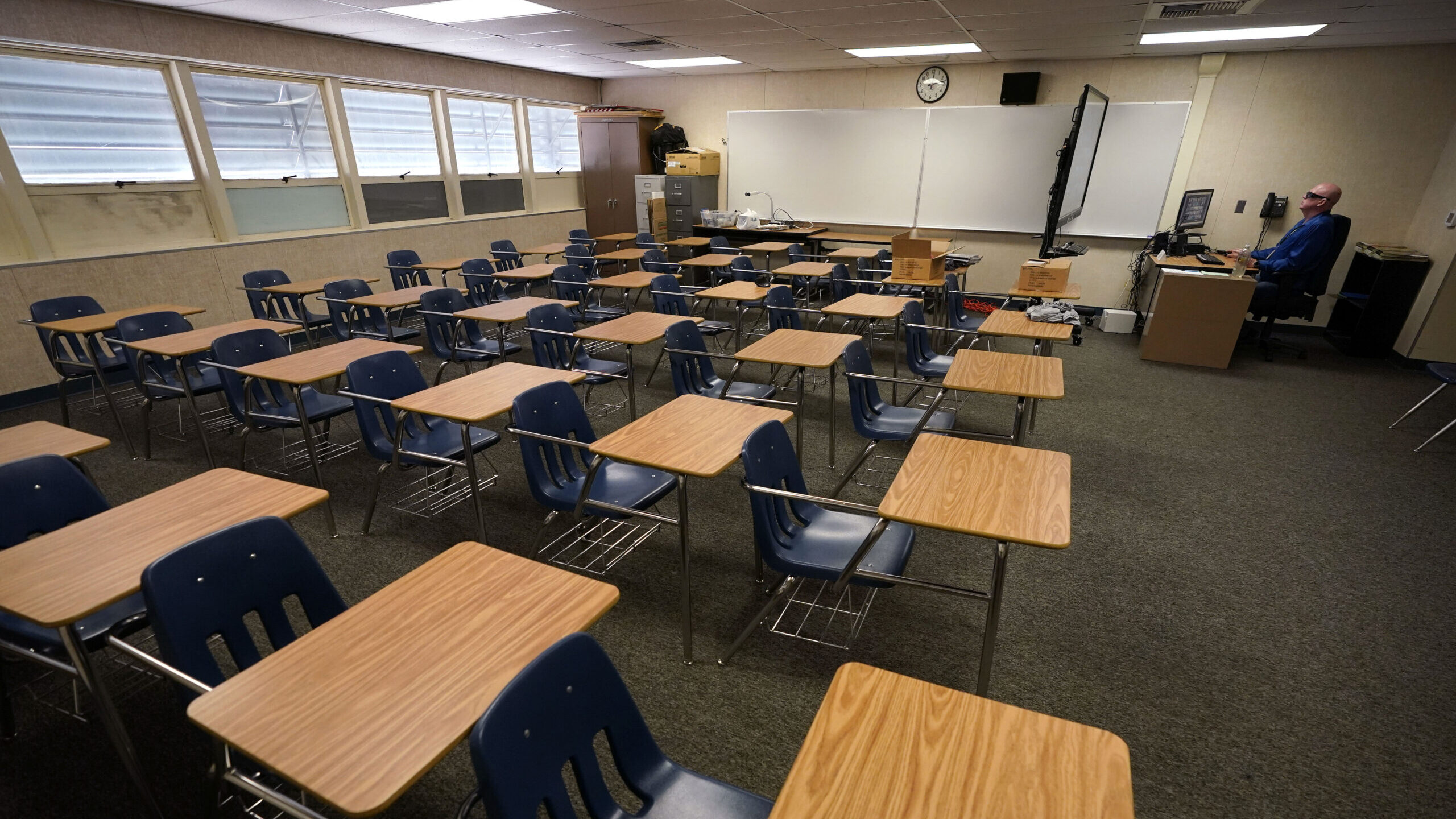 a classroom full of empty desks...