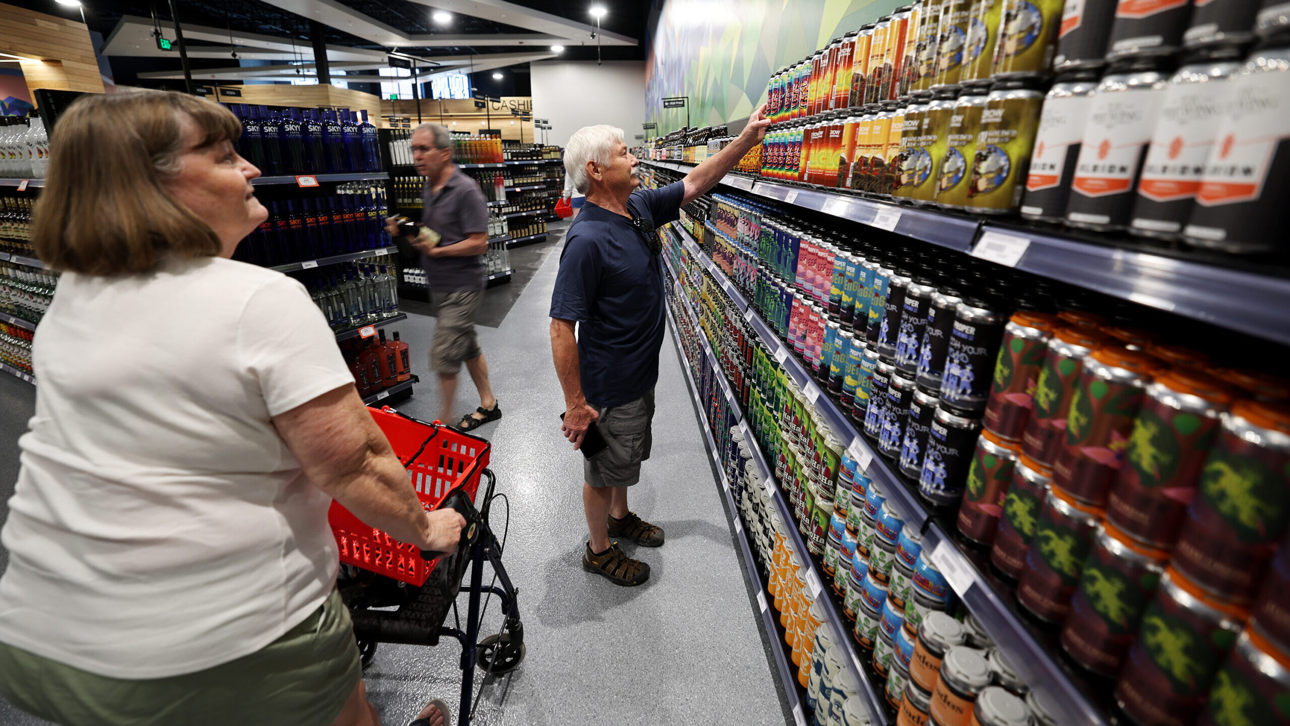 people shop at a utah liquor store, which are now collecting donations for charities...