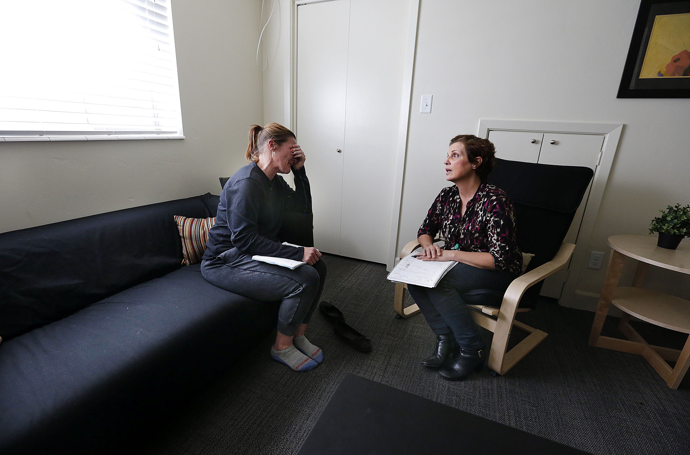 Client Cassie Wilkin, left, participates in individual therapy with Kelly Birch at CORE for Women, ...