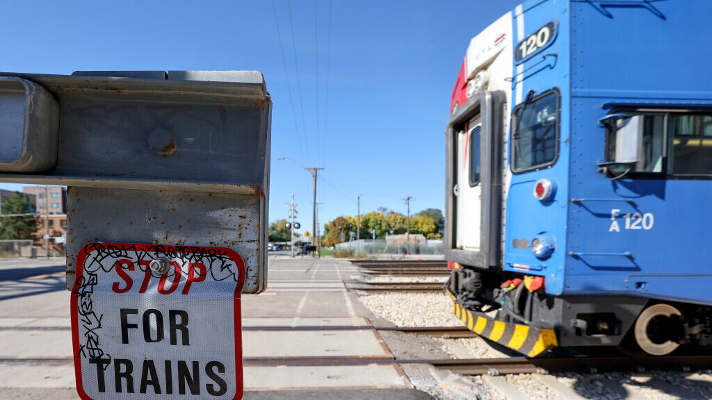 A FrontRunner train approaches the intersection of 300 North and 490 West that now has a new pedest...