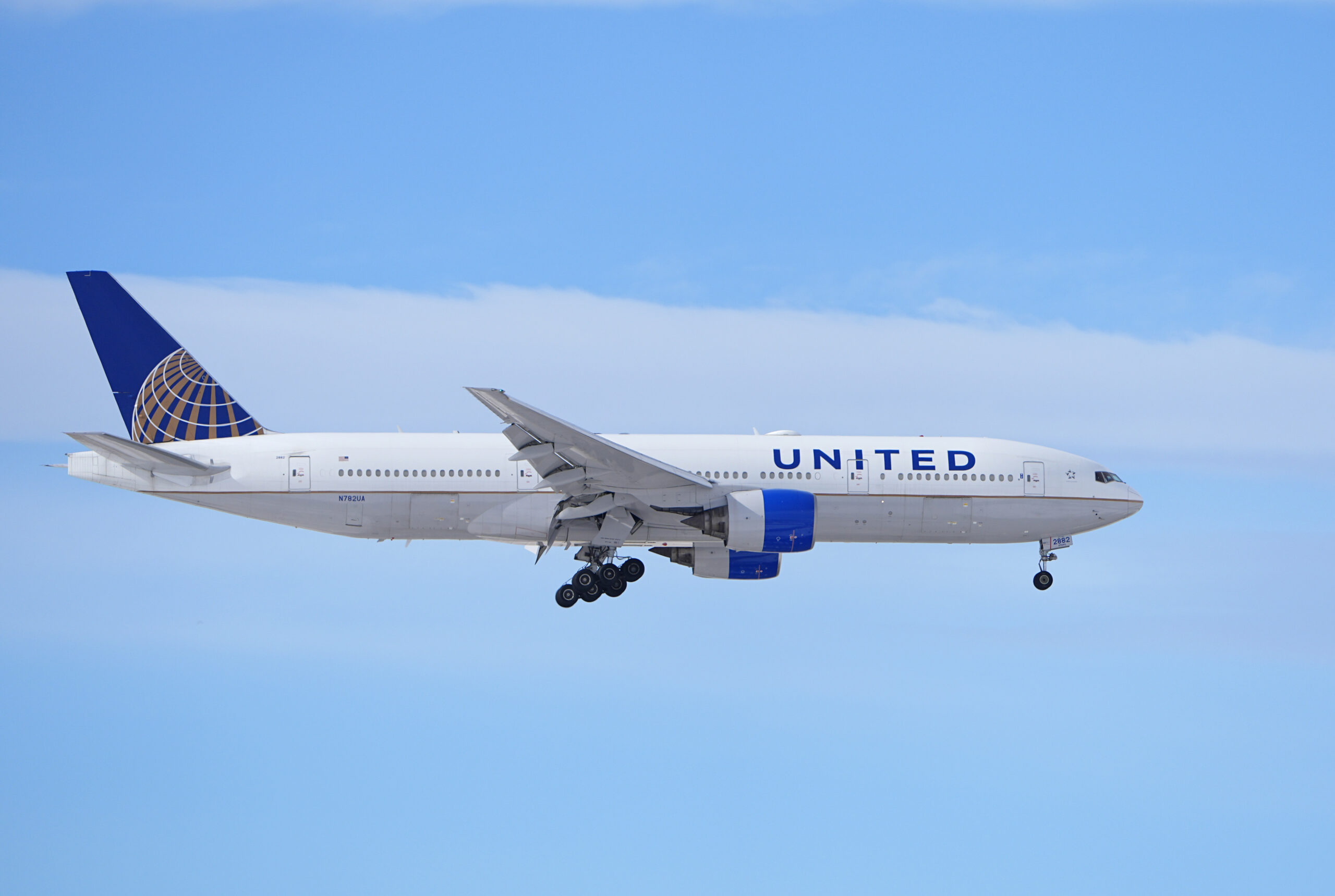 A United Airlines jetliner heads in for a landing at Denver International Airport. At United and Al...