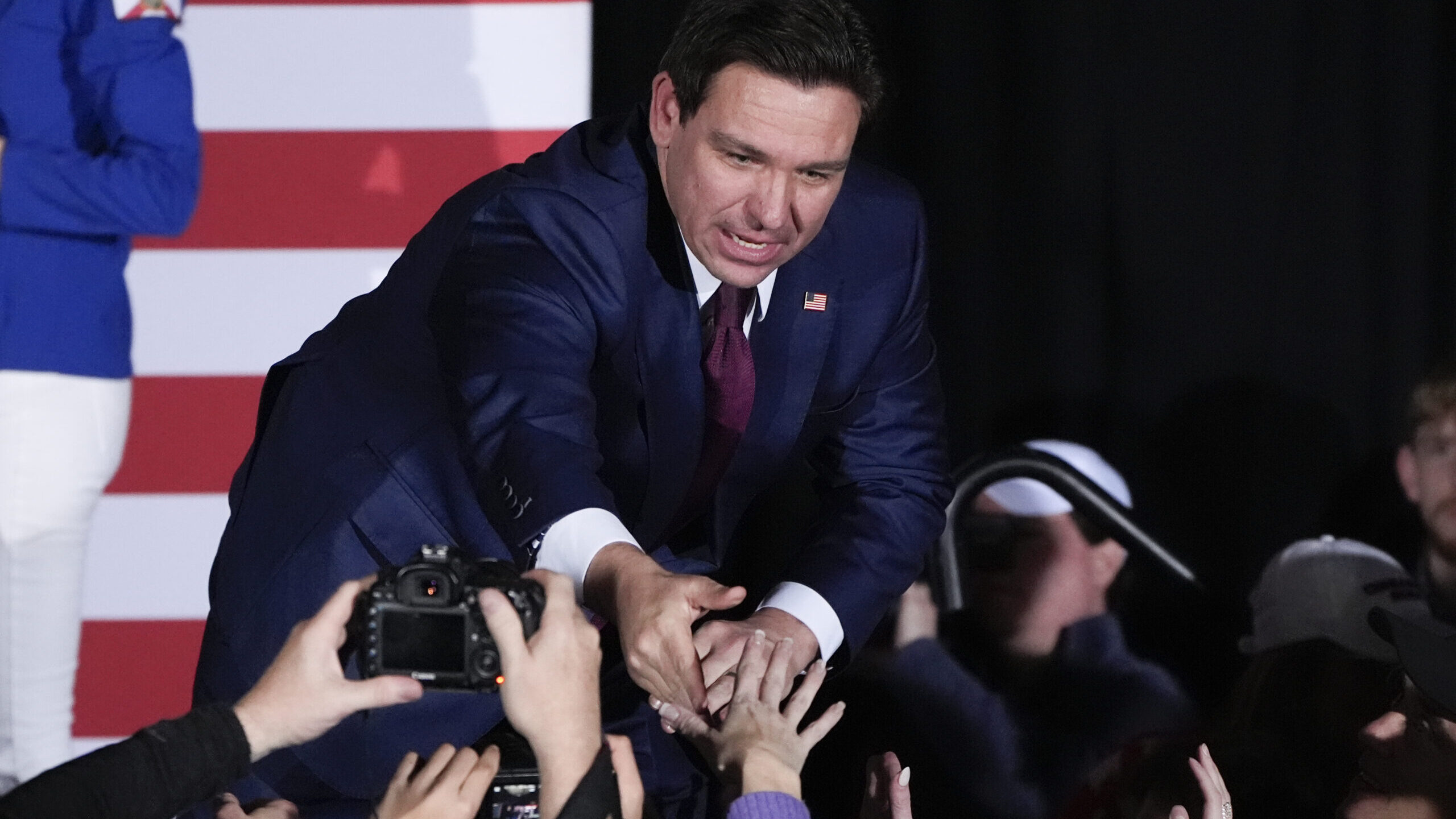 Republican presidential candidate Florida Gov. Ron DeSantis greets supporters during a caucus night...