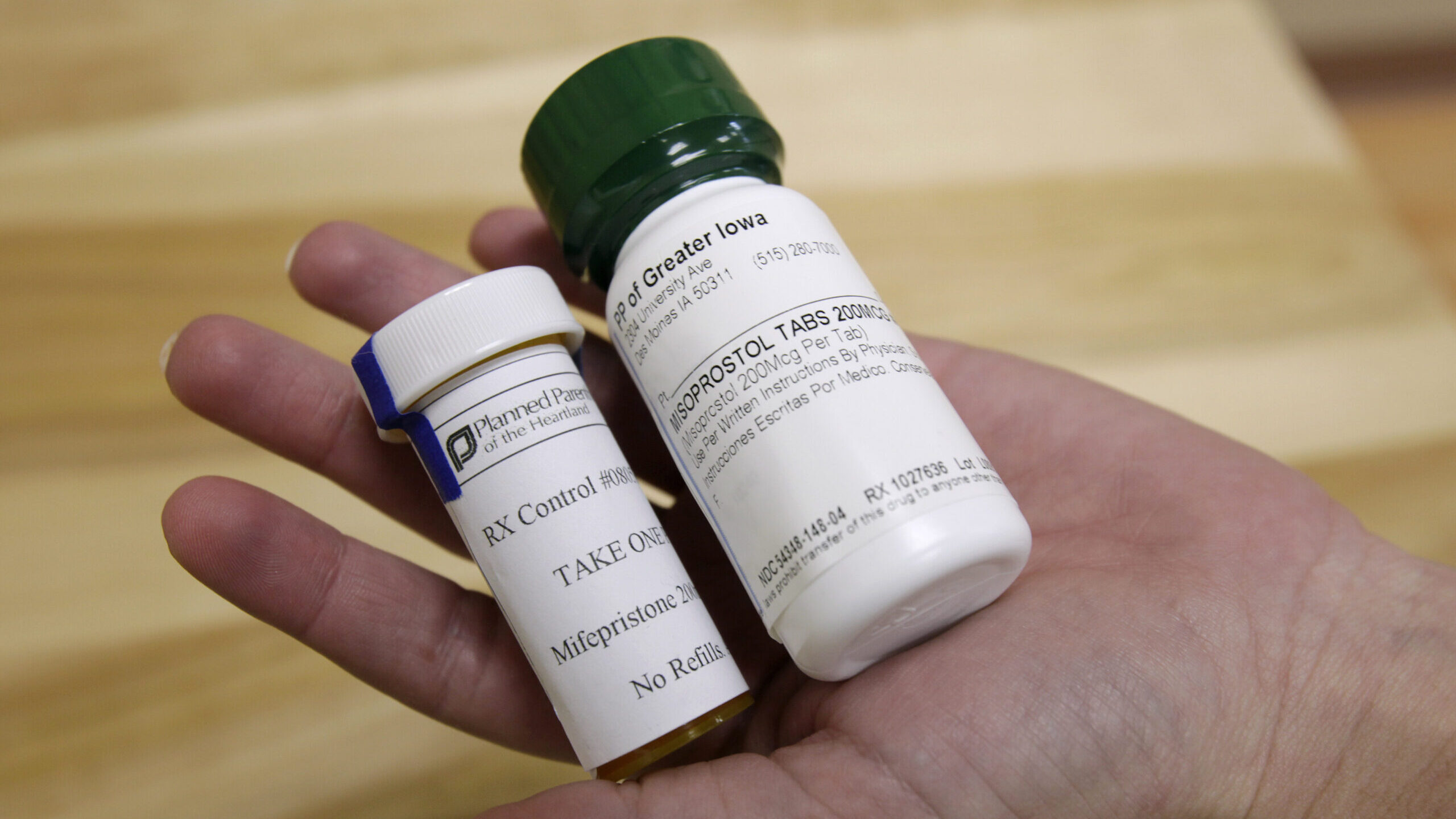 Bottles of abortion pills mifepristone, left, and misoprostol,...