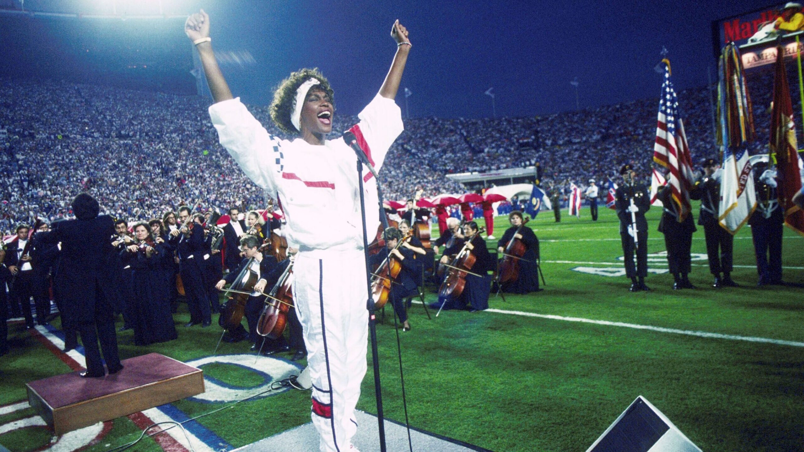 FILE: Whitney Houston sings the National Anthem during the pregame show at Super Bowl XXV while ten...