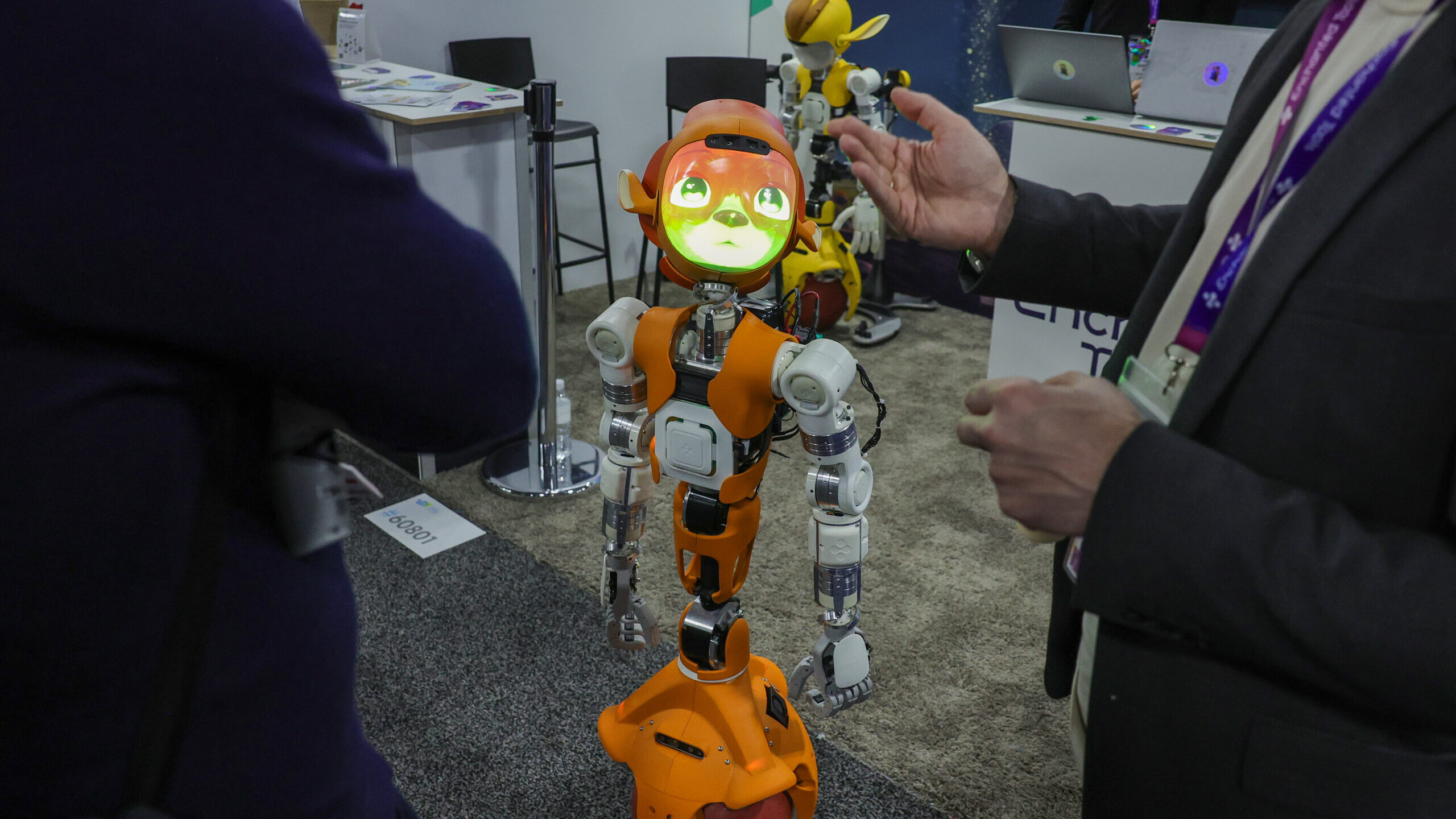 A Mirokai social logistics robot by Enchanted Tools uses its AI to interact with attendees in real ...