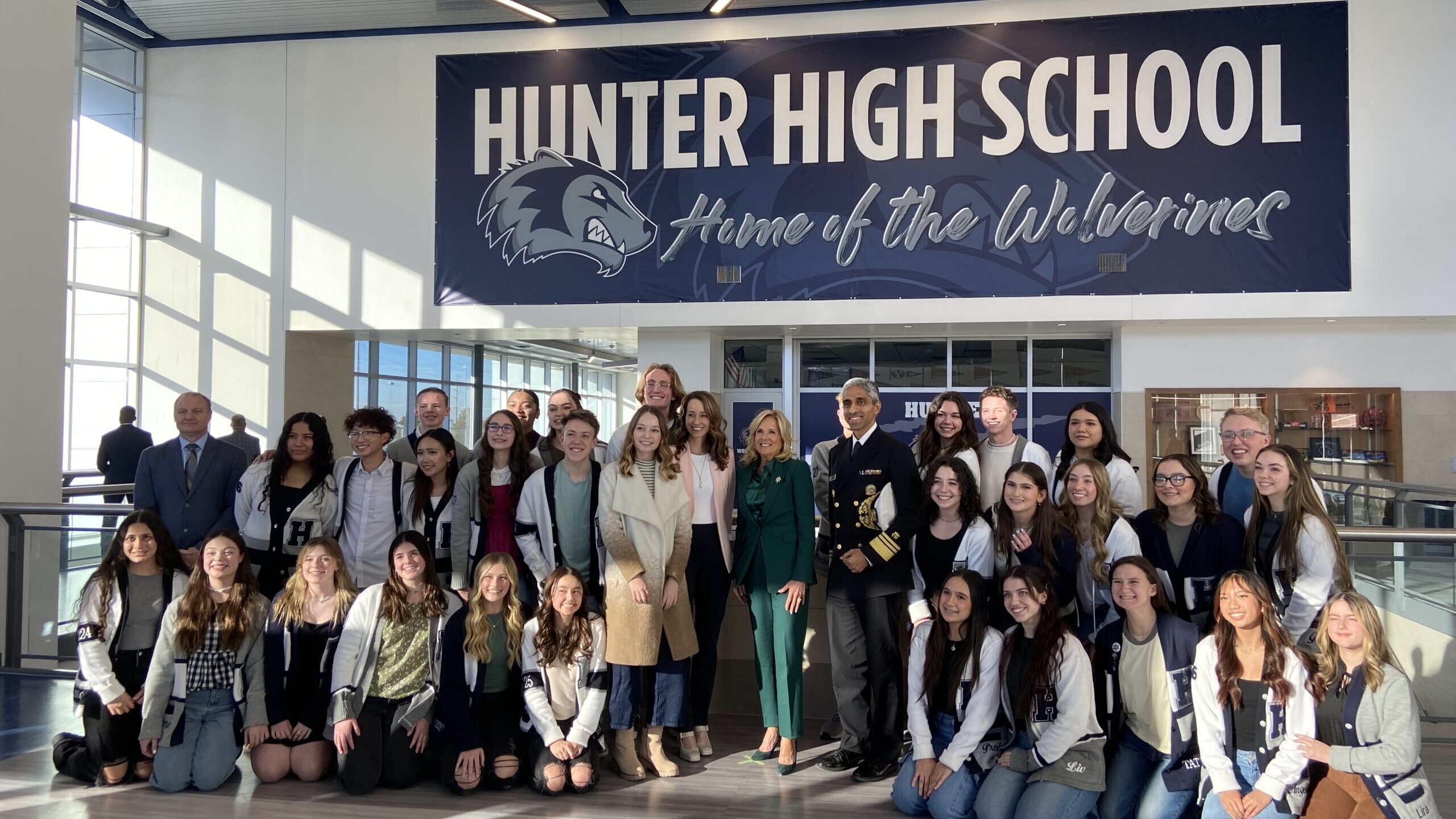 First Lady Jill Biden and Utah First Lady Abby Cox standing with students from Hunter High School o...