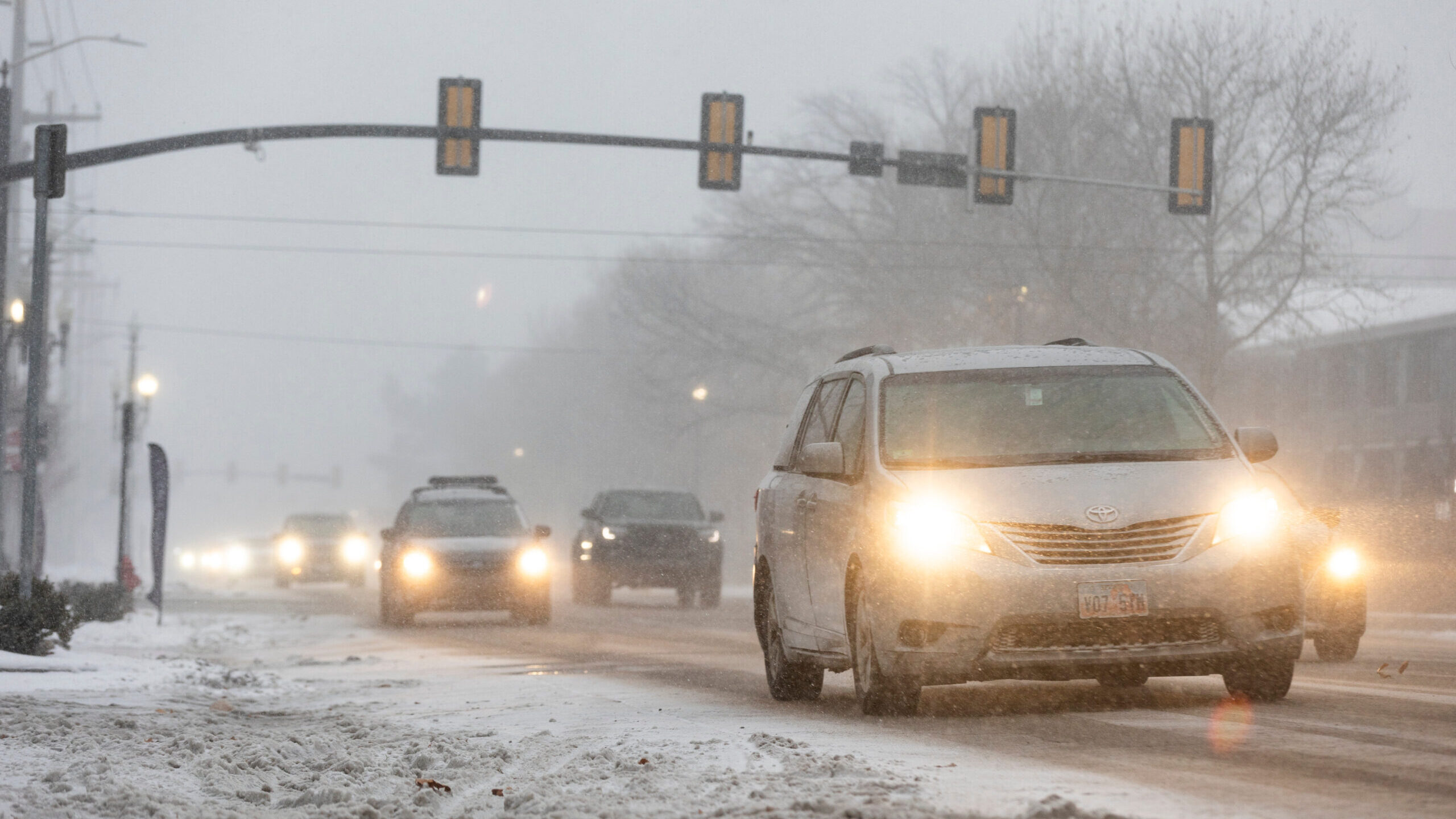 Cars drive through a snowstorm in Salt Lake City on Jan. 10, 2024....