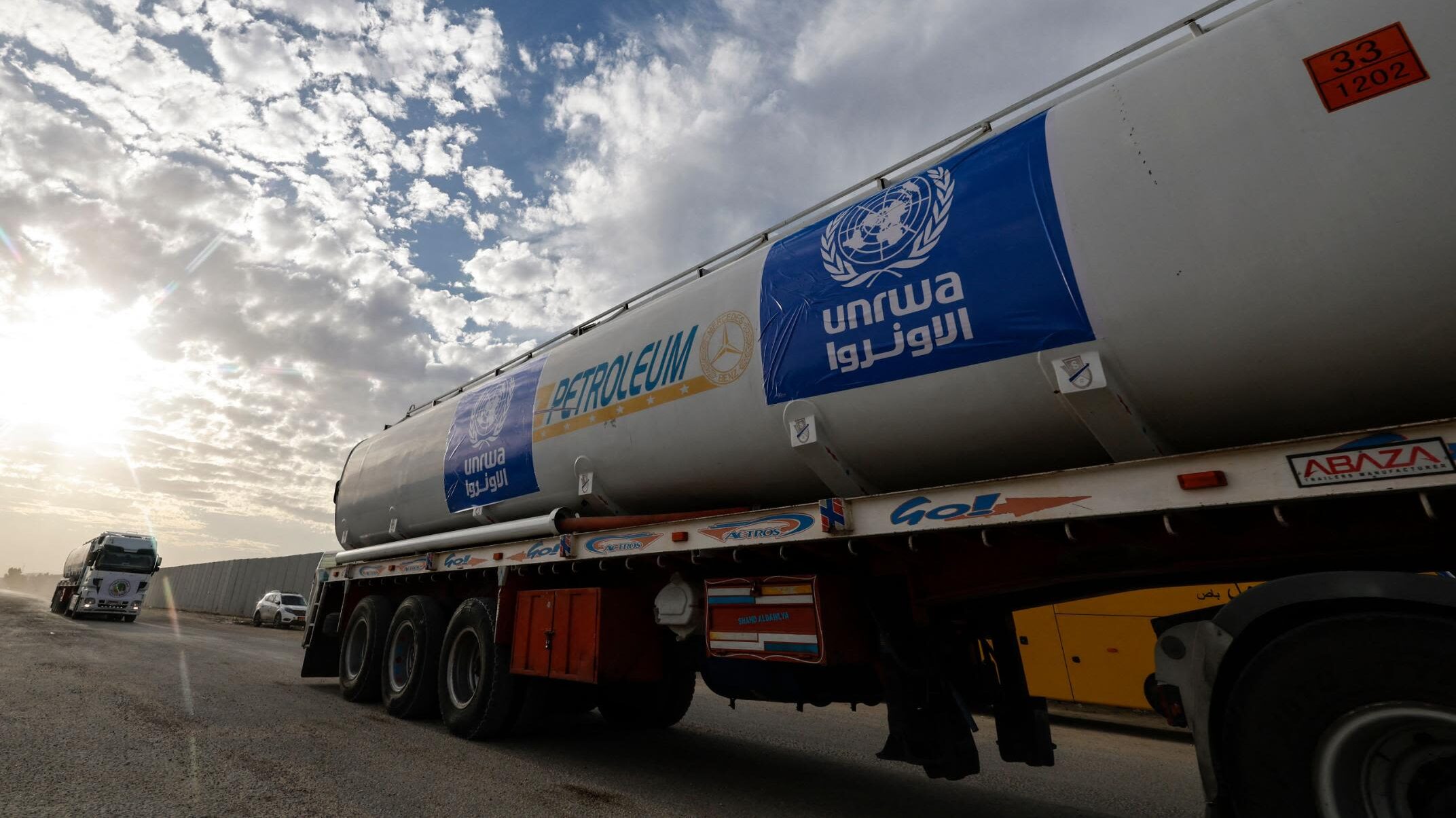 Trucks of the United Nations Relief and Works Agency for Palestine Refugees (UNRWA) carrying fuel a...