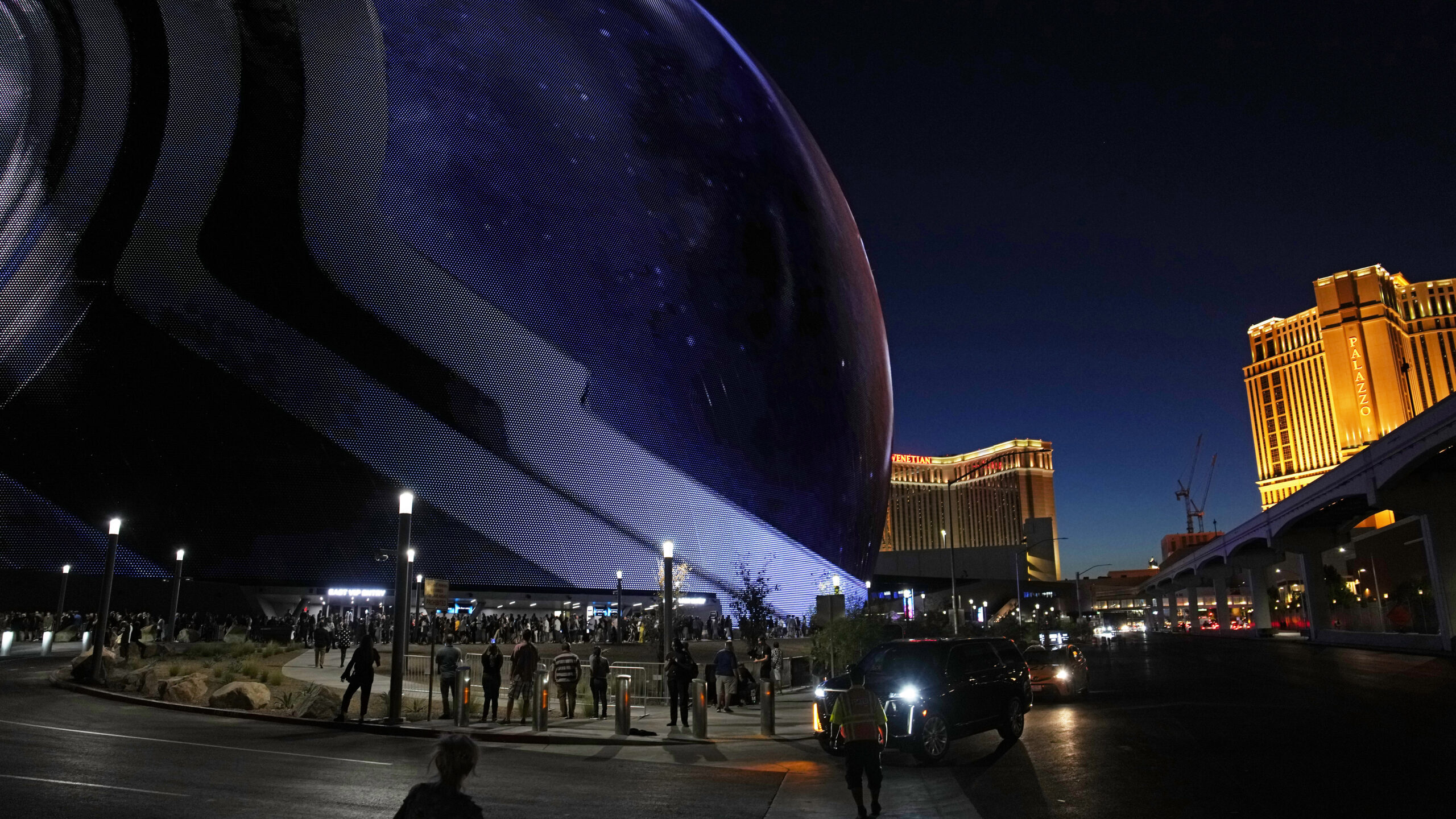 FILE - People arrive during the opening night of the Sphere, Sept. 29, 2023, in Las Vegas. A man wh...
