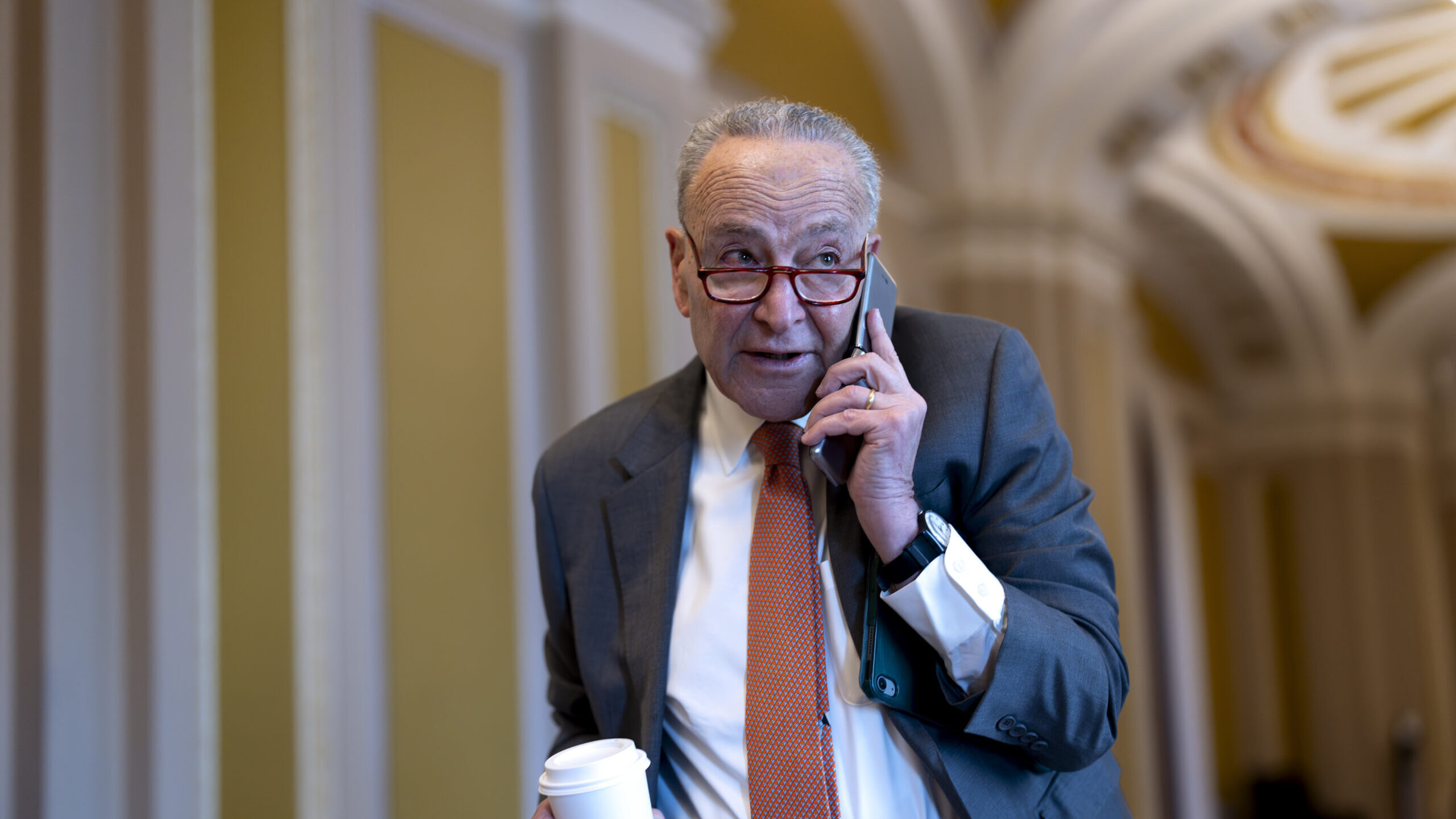 Senate Majority Leader Chuck Schumer, D-N.Y., arrives at the Capitol while Republicans hold a close...