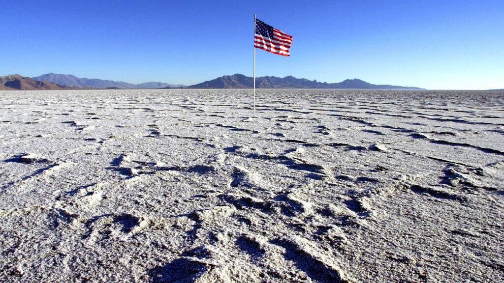 A lone American flag waves in the morning breeze Wednesday, Aug. 14, 2002, at the Bonneville Salt F...