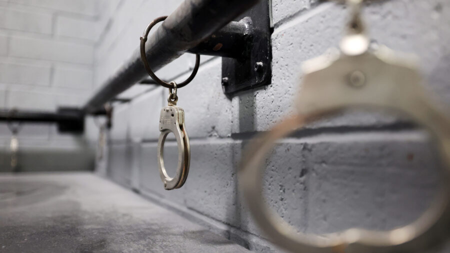 FILE — Handcuffs hang from a rail inside the Wasatch entry of the old Utah State Prison in Draper...