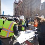 Construction team members gather Tuesday, February 13, 2024, to sign some of the final reinforcing steel that will go atop the Salt Lake Temple. 2024 by Intellectual Reserve, Inc. All rights reserved.