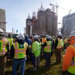 Construction team members gather Tuesday, February 13, 2024, to sign some of the final reinforcing steel that will go atop the Salt Lake Temple. 2024 by Intellectual Reserve, Inc. All rights reserved.