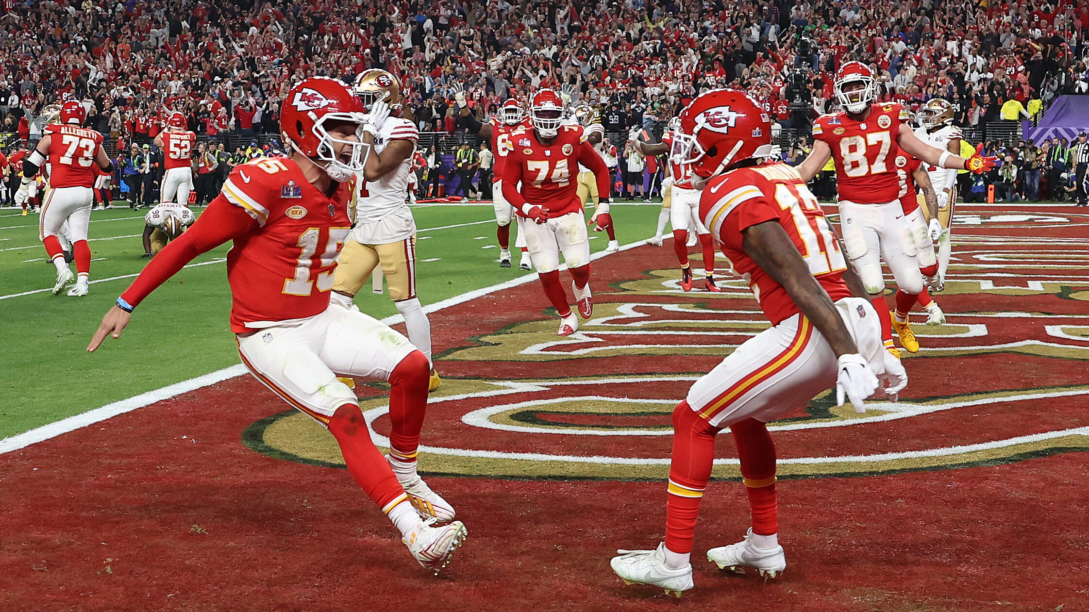 Mecole Hardman Jr. #12 of the Kansas City Chiefs celebrates with Patrick Mahomes #15 and after scor...