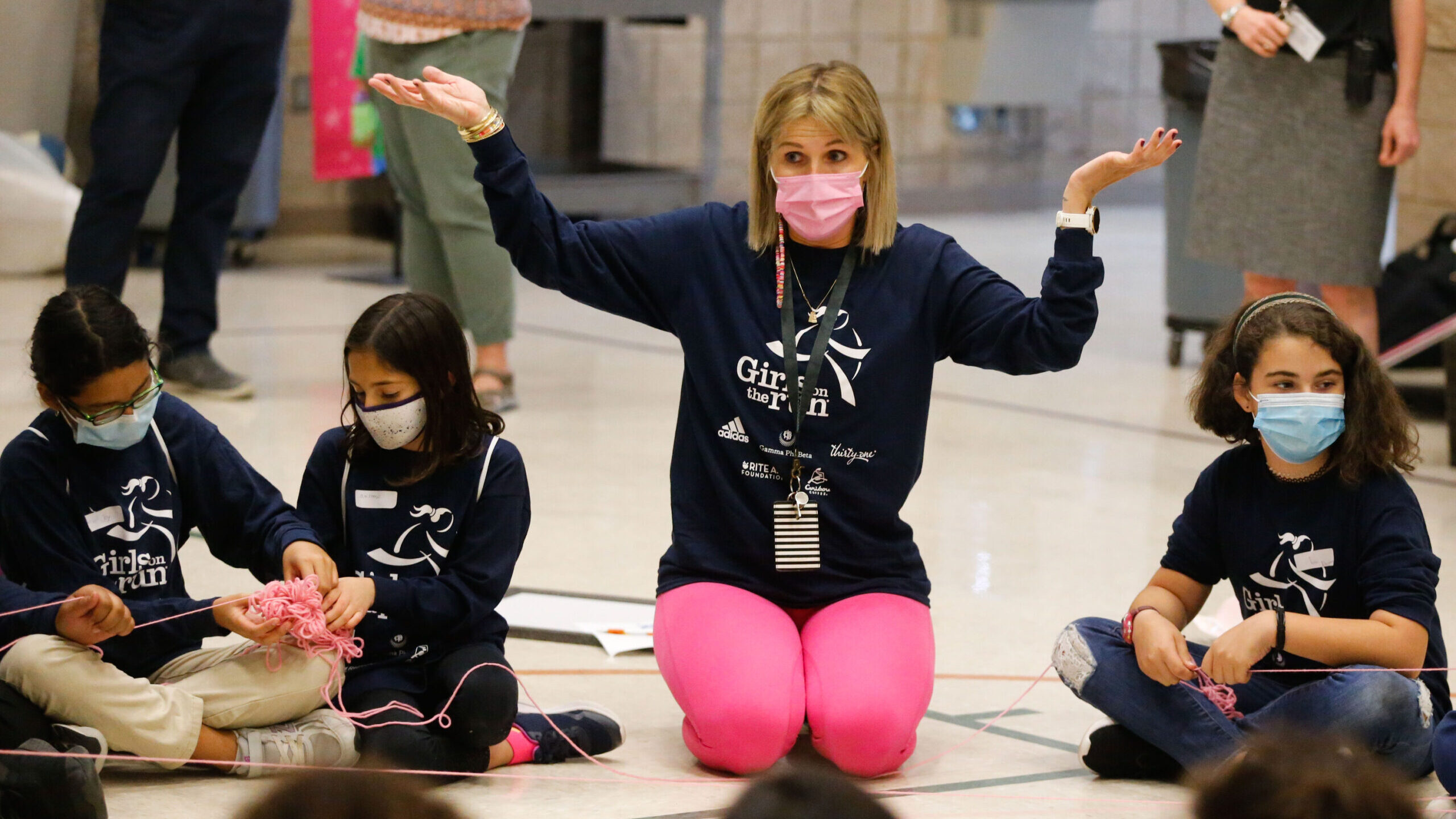 FILE: Mountain View Elementary coach and teacher Katelyn Bradley instructs students during a team p...
