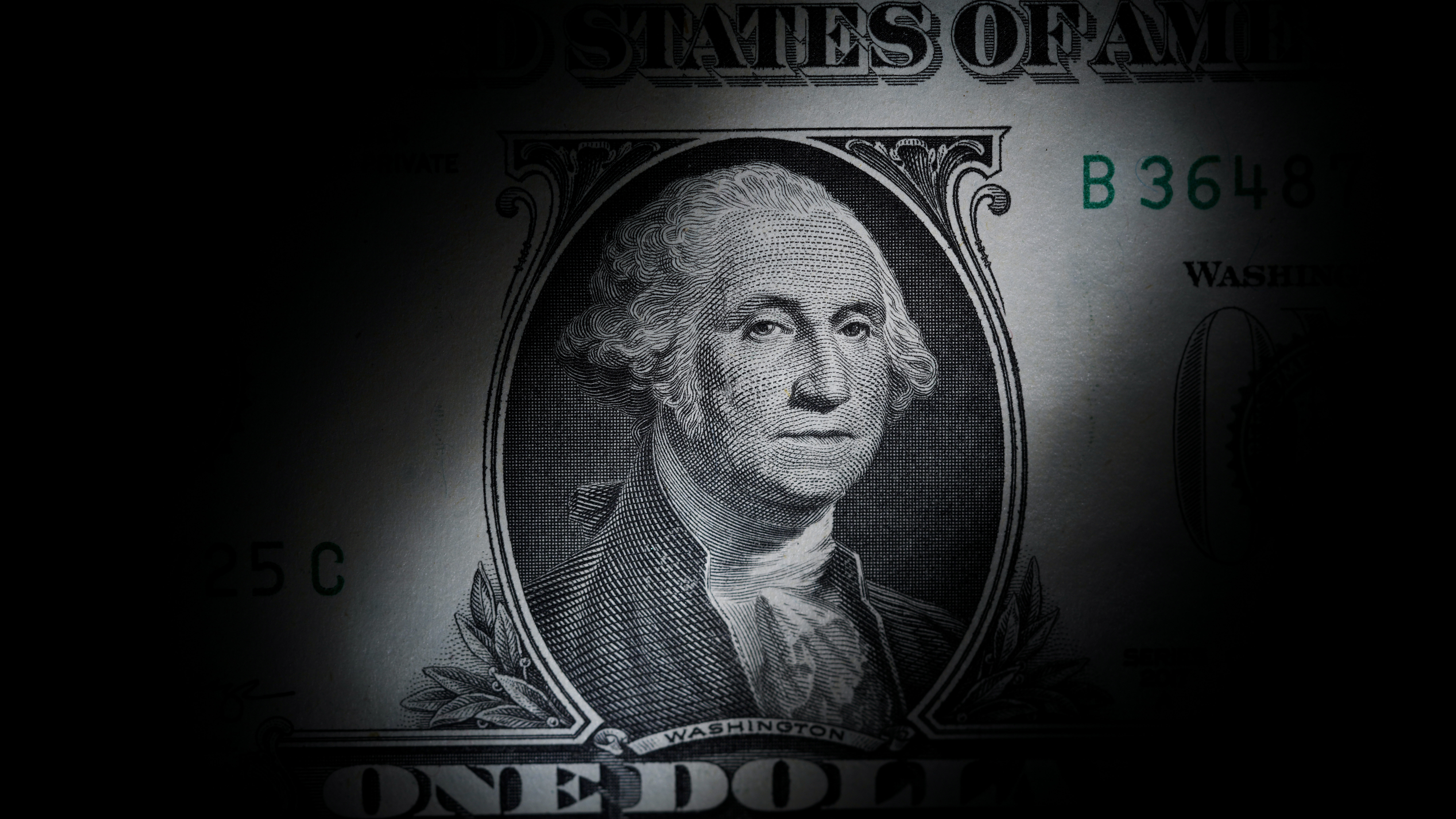 The likeness of George Washington is seen on a U.S. $1 bill, March 13, 2023, in Marple Township, Pa...