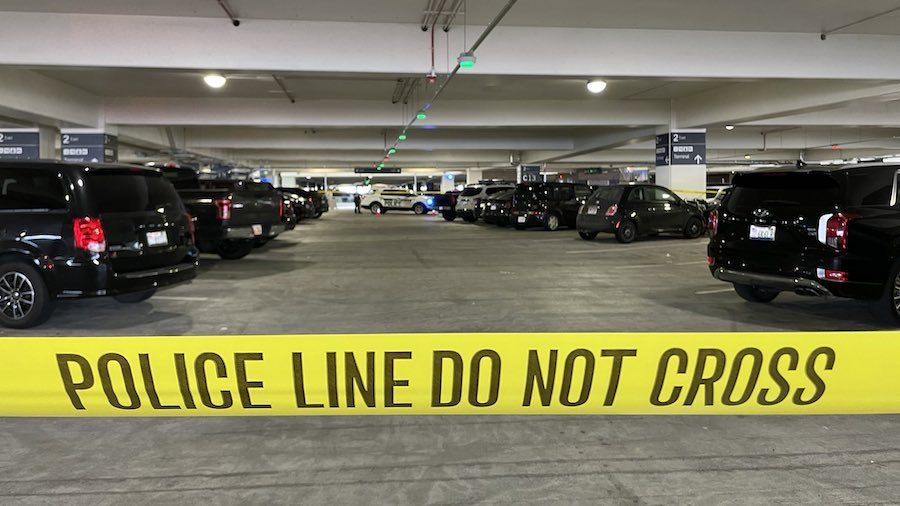 police tape in an airport parking garage, a lawsuit related to this case was filed against delta...