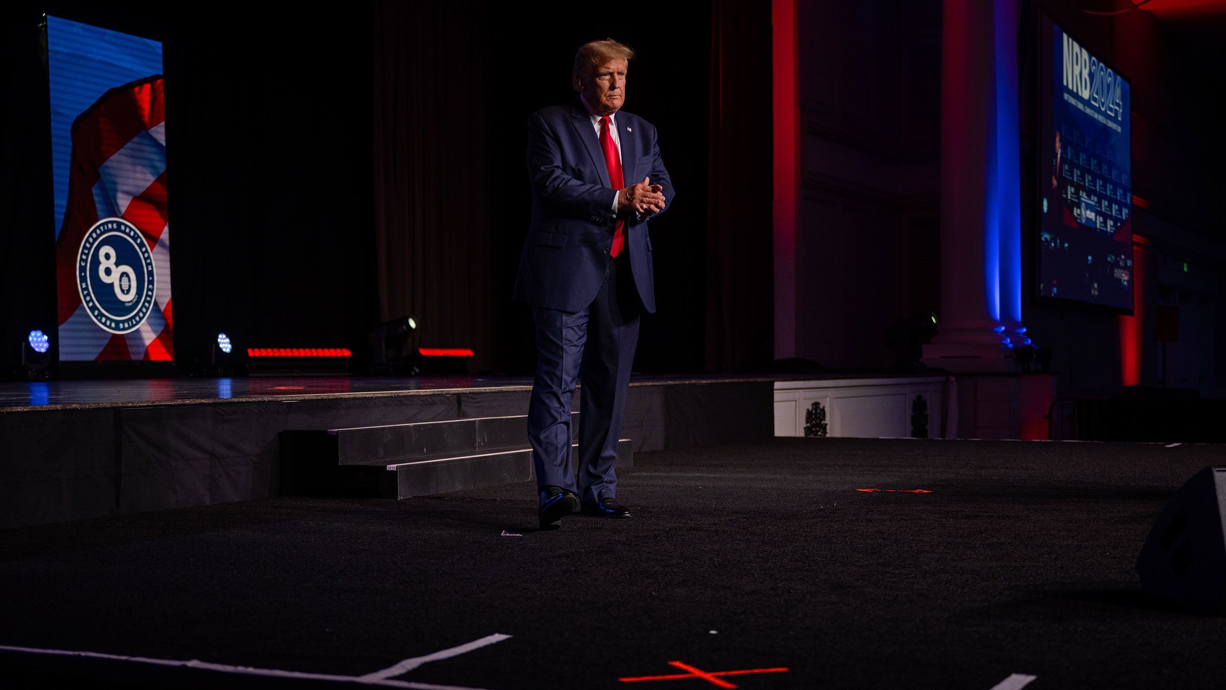 Former President Donald Trump walks on stage during the 2024 NRB International Christian Media Conv...