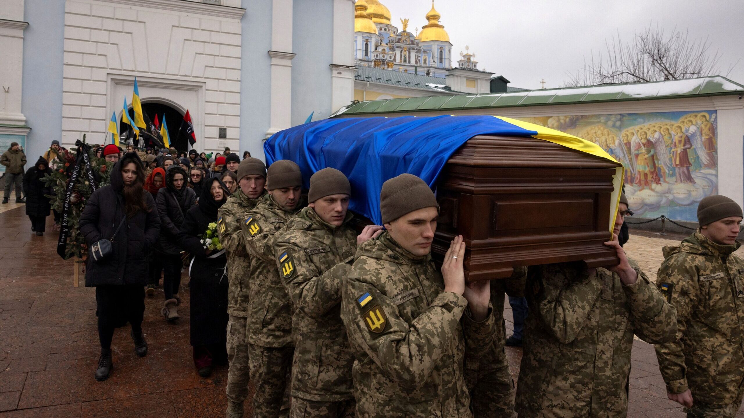 Soldiers carry the coffin of Ukrainian poet and serviceman Maksym Kryvtsov who was killed in action...