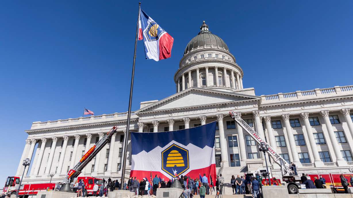 Utah's new state flag flies in front of the state Capitol for the first time after a celebration to...