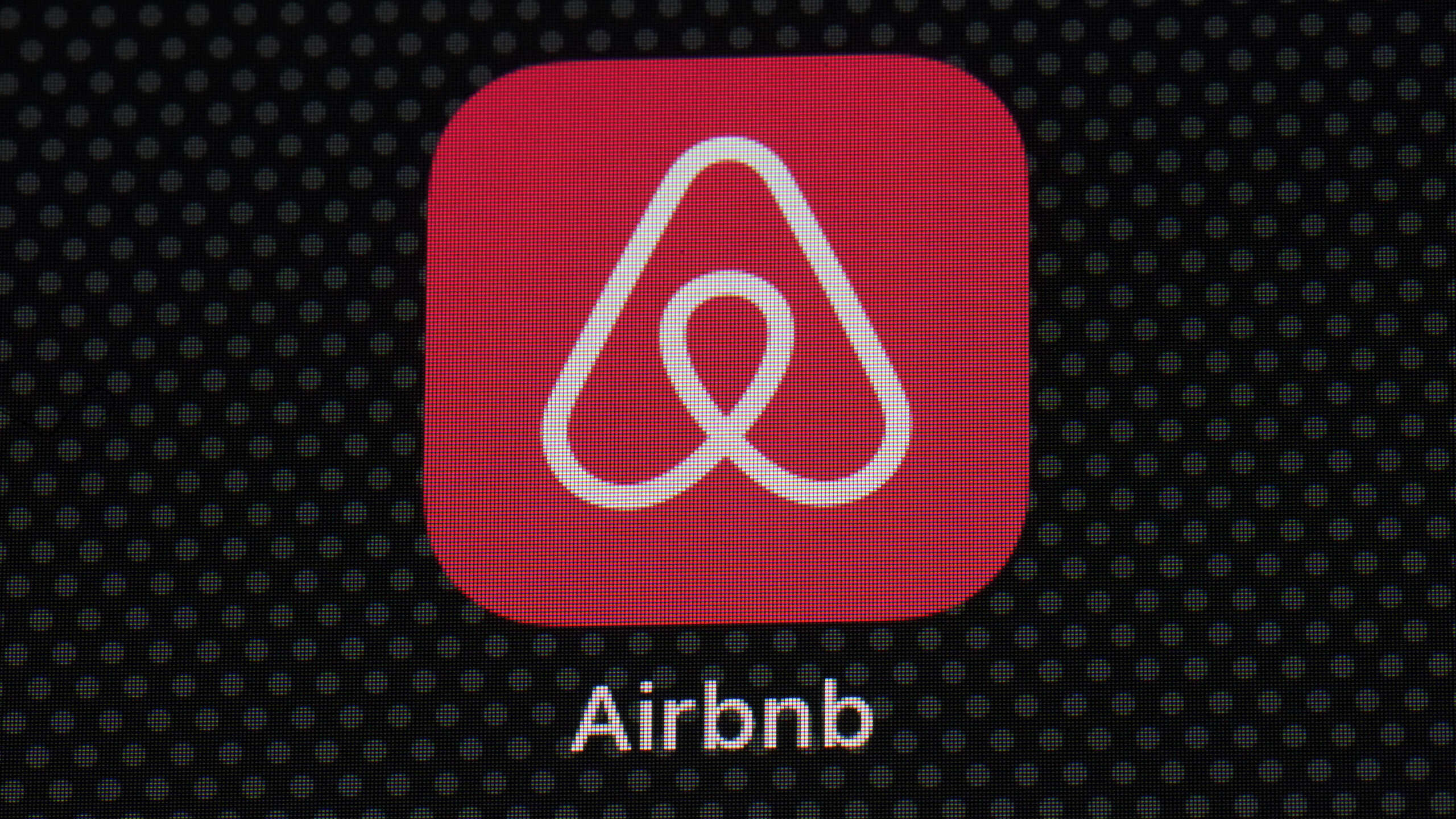 The Airbnb app icon is displayed on an iPad screen in Washington, D.C., on May 8, 2021....