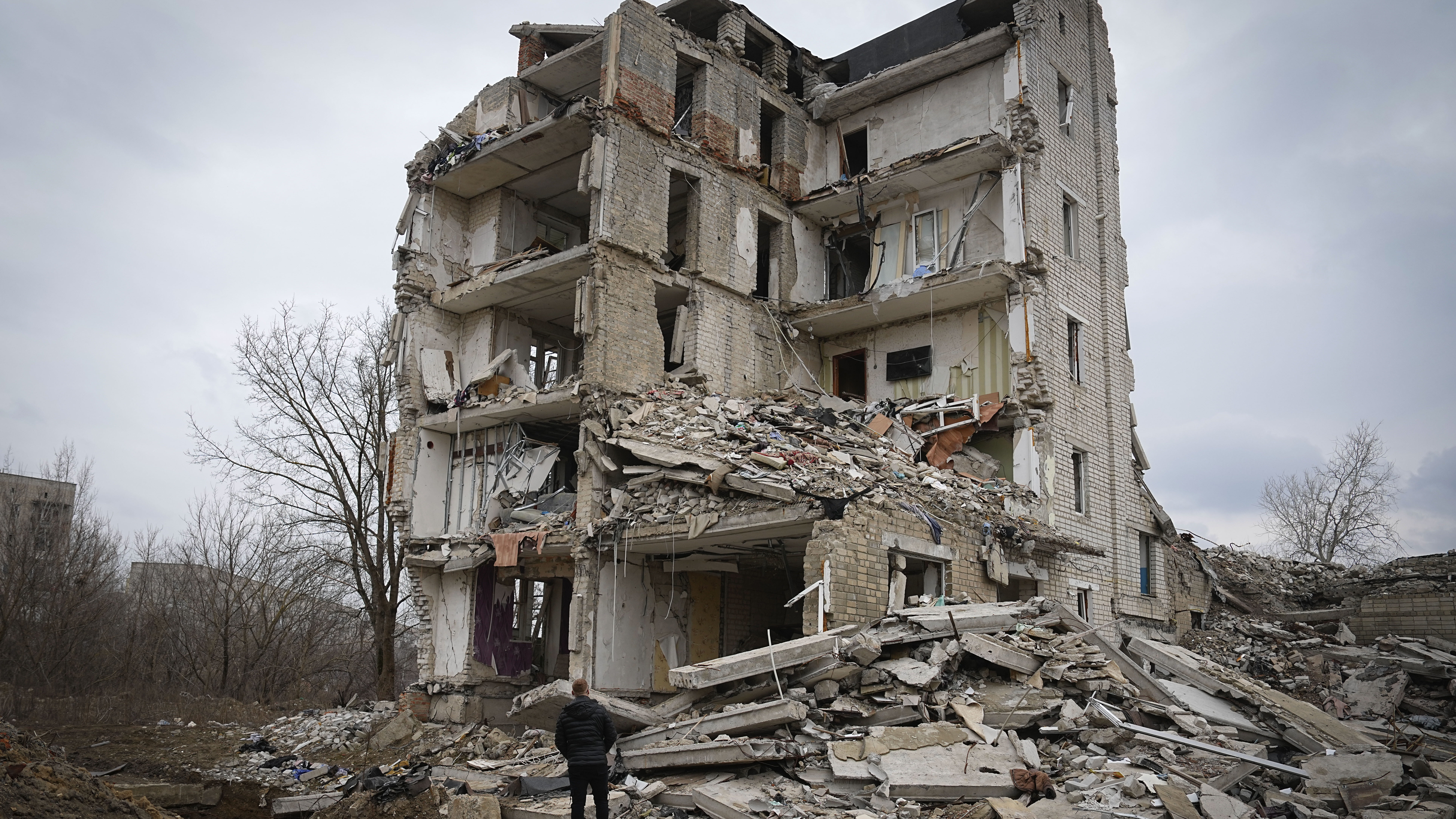a wrecked apartment in Ukraine is shown, Putin says Russian forces aim to set up a buffer zone insi...