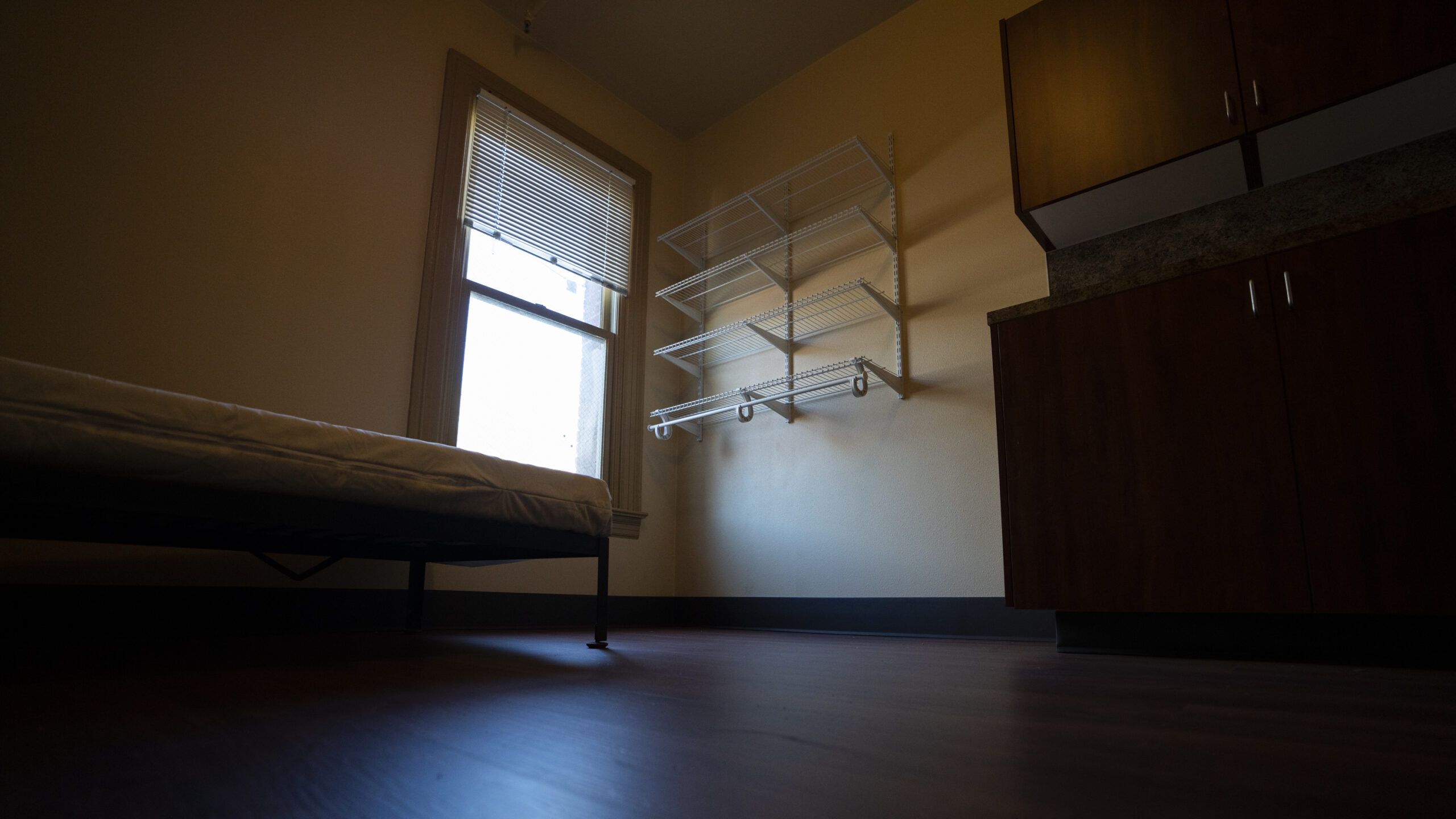 An empty bedroom is seen in an affordable housing building run by Central City Concern, a Portland-...