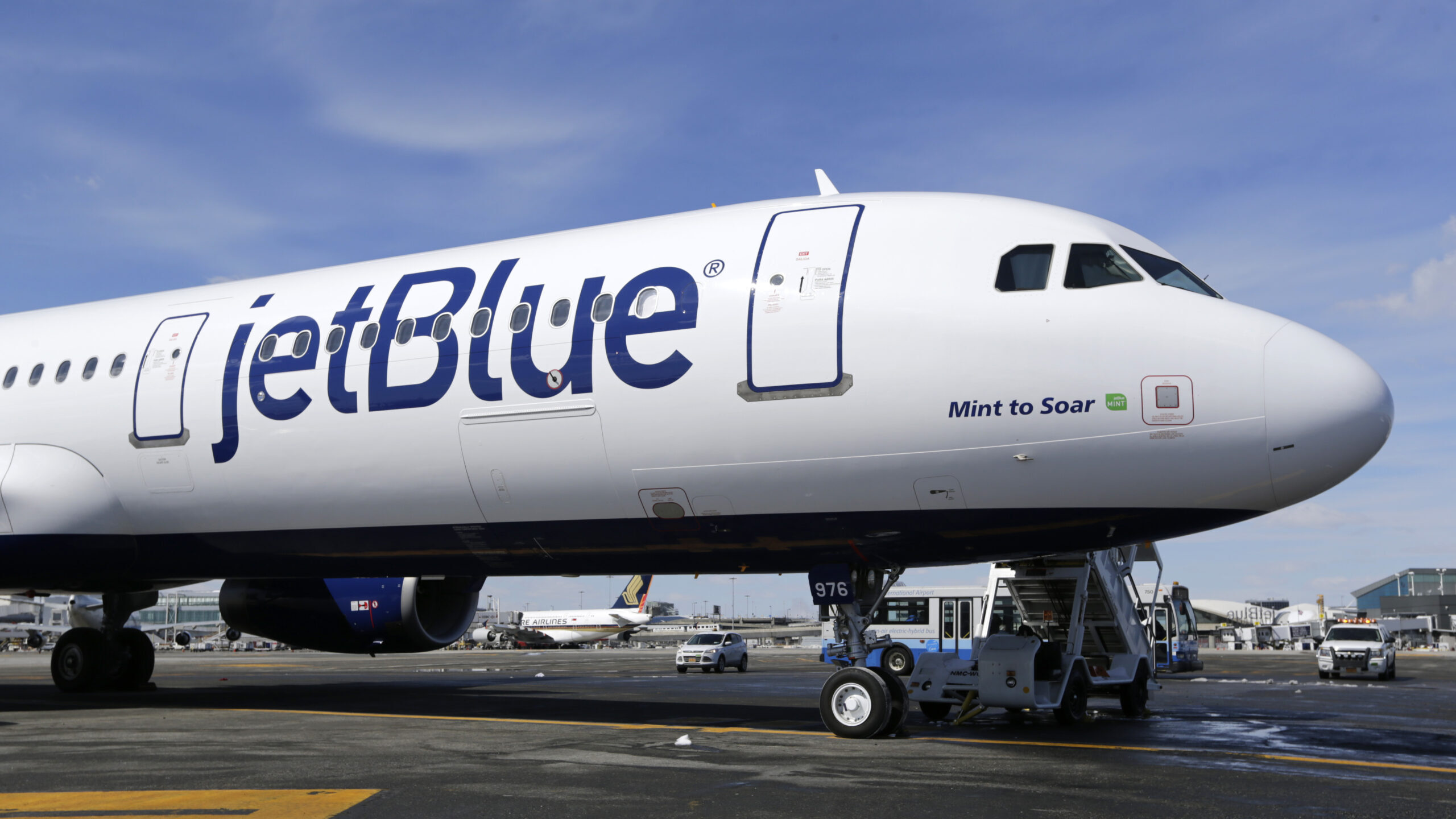 A JetBlue airplane is seen, March 16, 2017, at John F. Kennedy International Airport in New York....