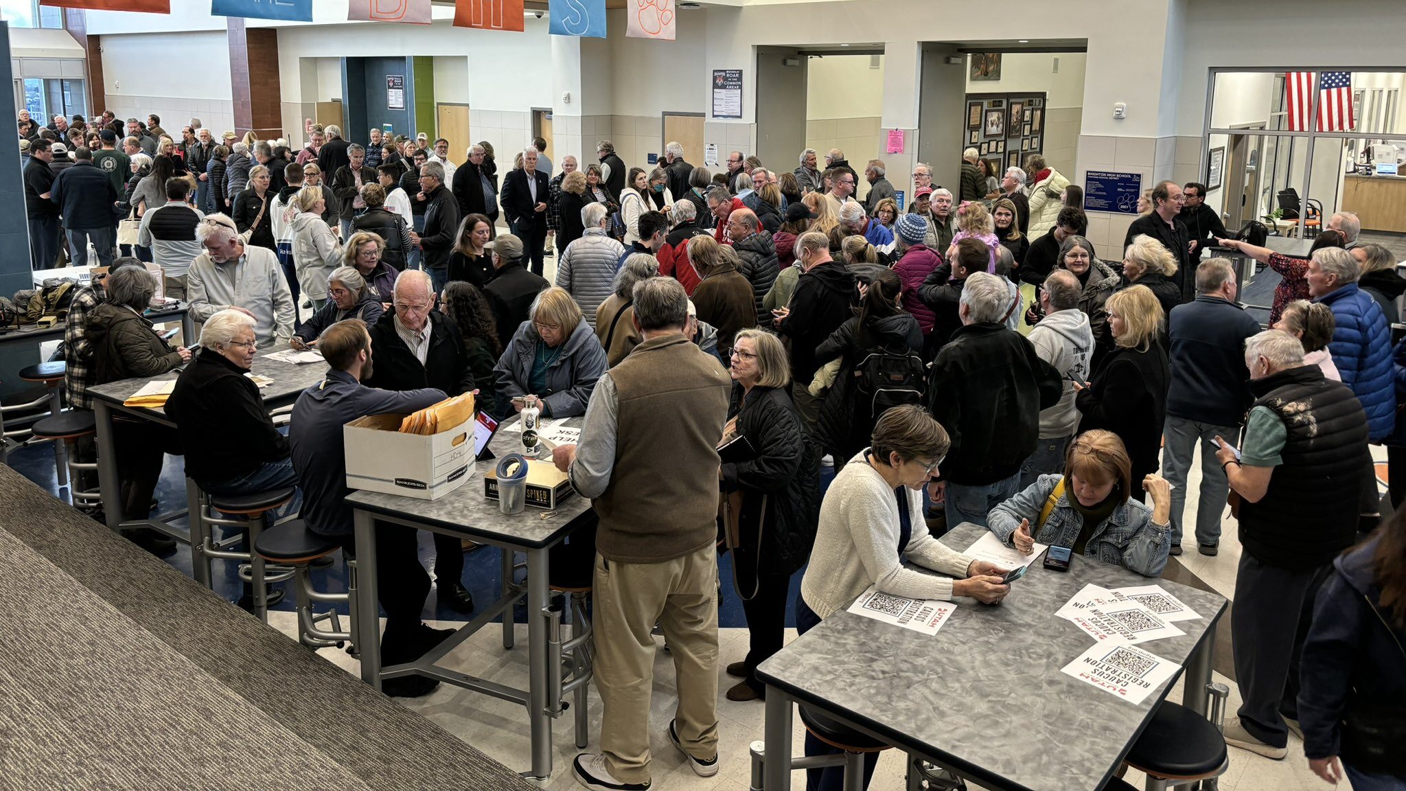 People check in to caucus at Brighton High School on Tuesday, March 5....