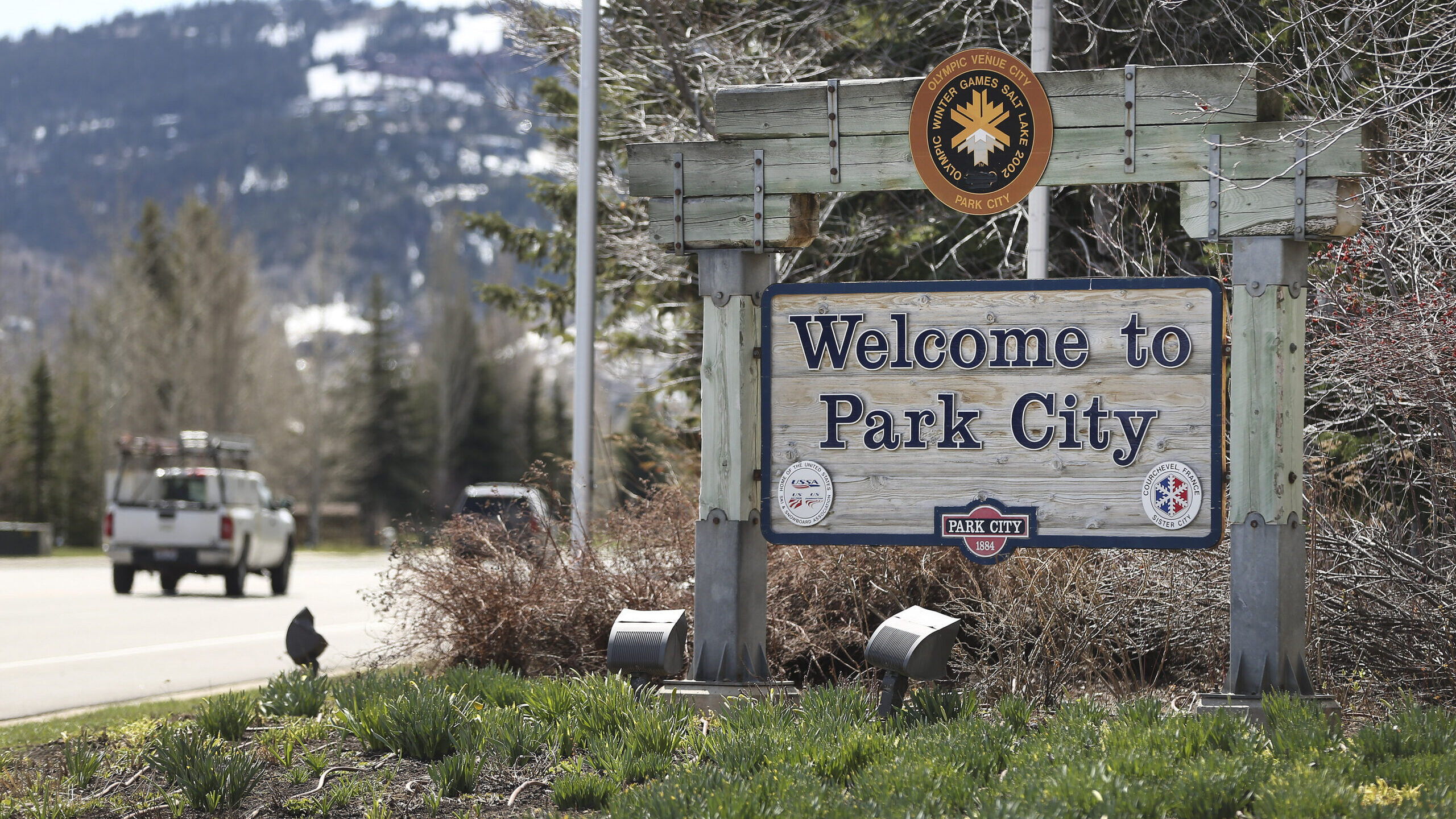 park city welcome sign is pictured, the city is hosting the park city cardboard sled derby tomorrow...