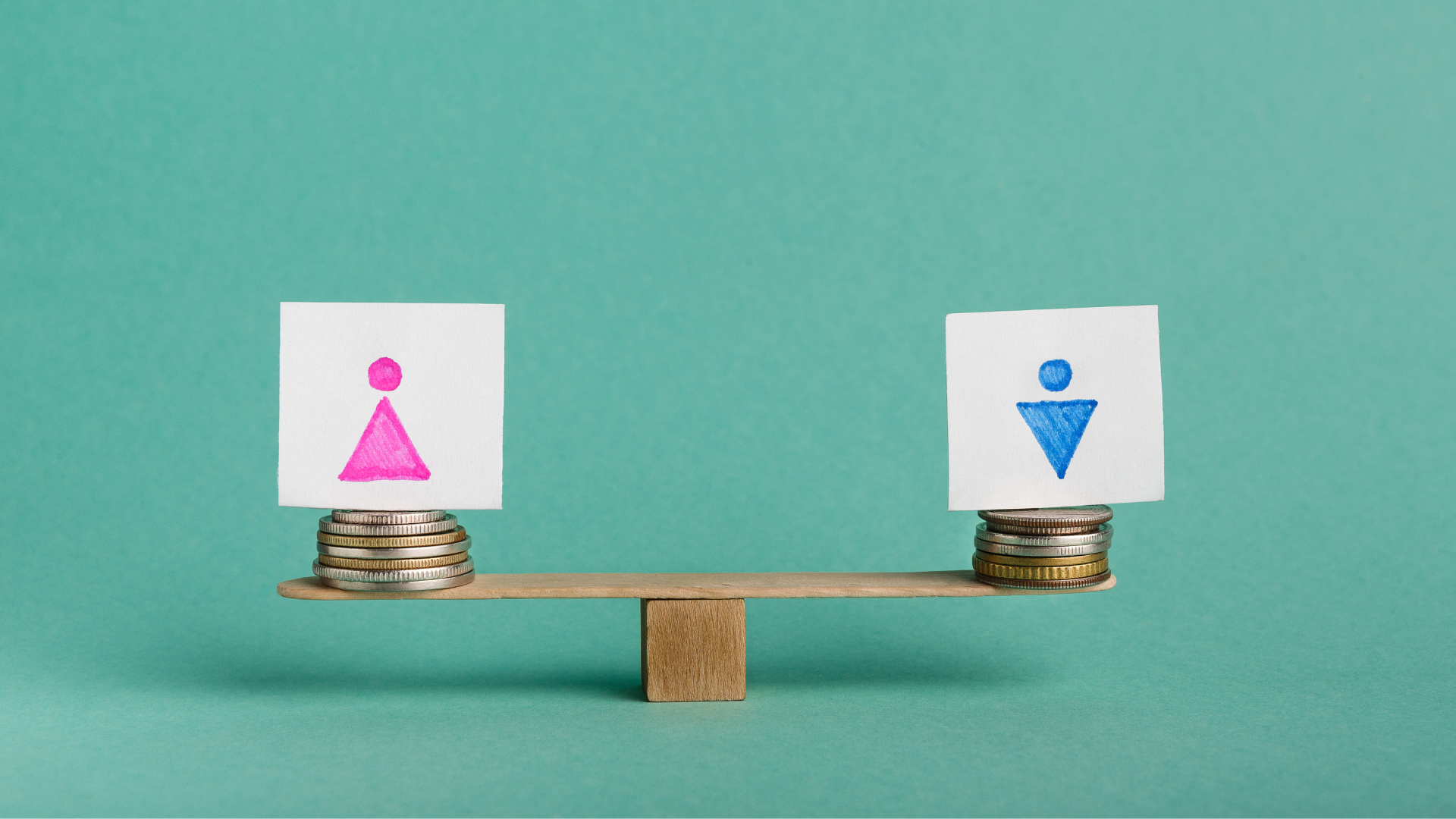 Equal Pay for man and woman, cards with gender figures and similar coin stacks on seesaw symbolizin...