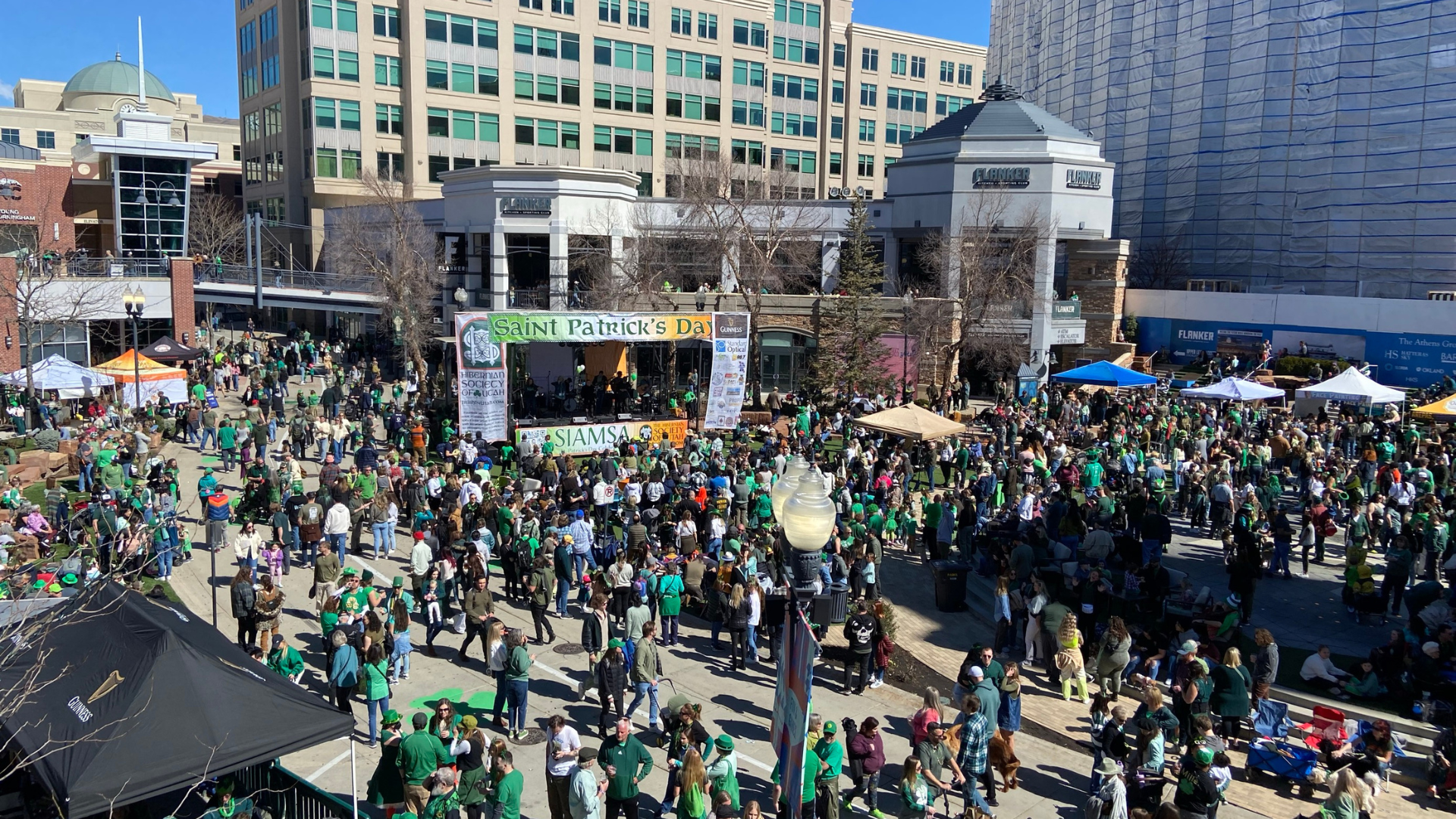 A crowd of people wearing green gathered at The Gateway for St. Patrick's Day....