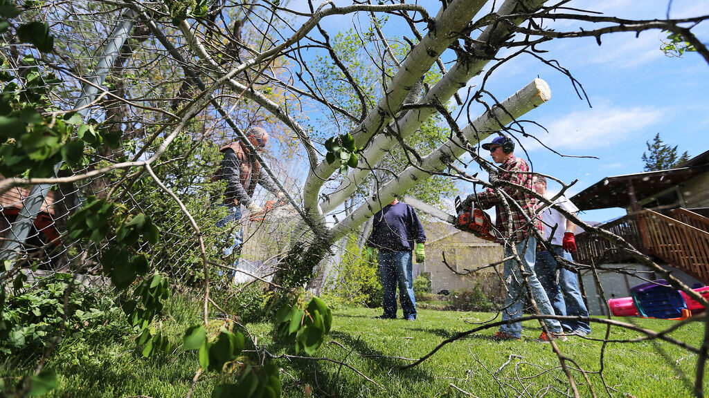Farmington residents ban together to help clean up after a wind storm in the Davis County area on S...