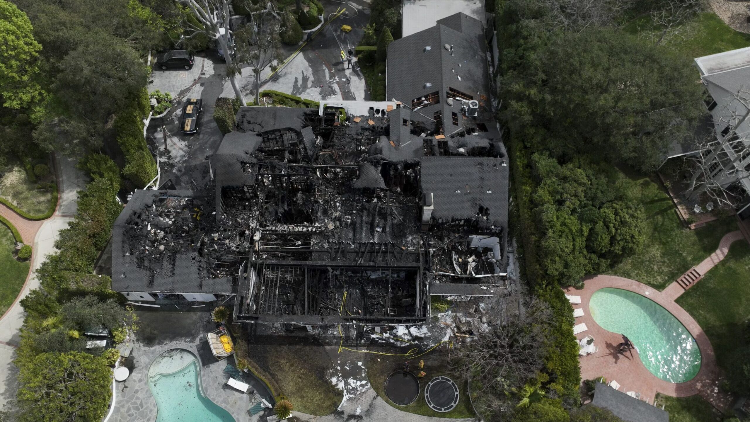 An aerial view of a fire-damaged property, which appears to belong to Cara Delevingne, on March 15 ...