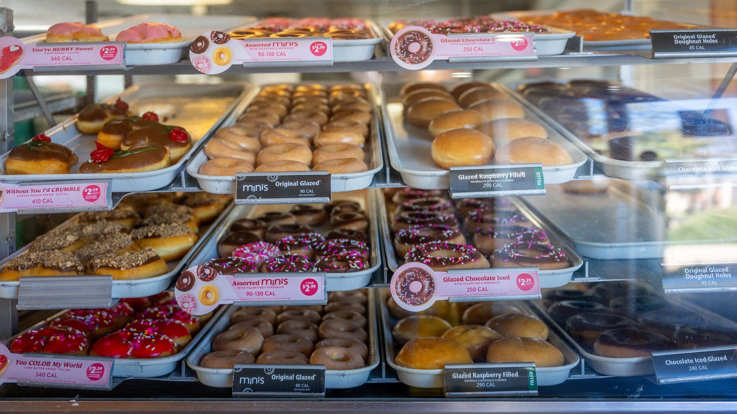Doughnuts are displayed for sale at a Krispy Kreme store on February 13, in Austin, Texas. Krispy K...