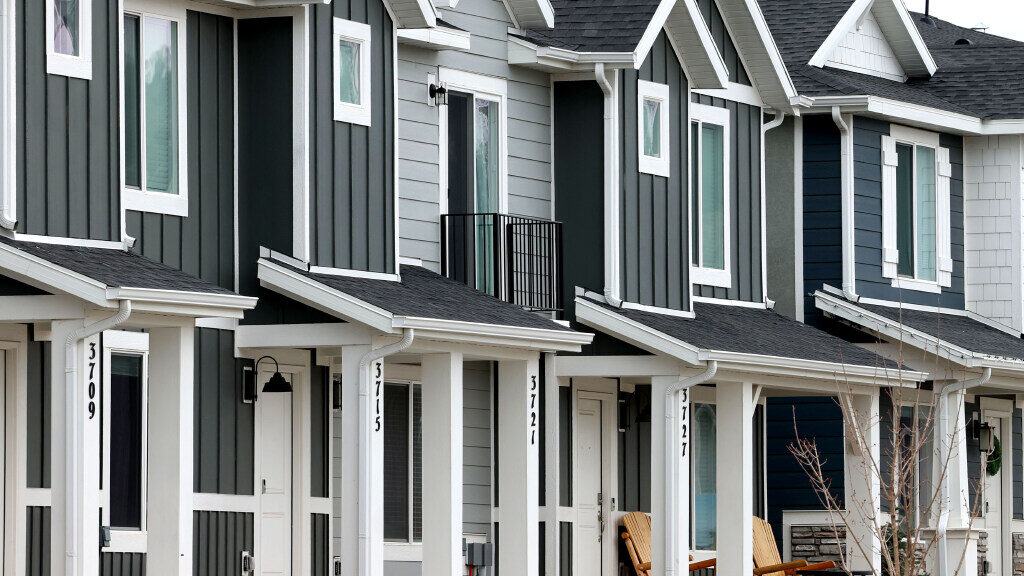 Utah wants homes to go to owners not renters. Grey homes are pictured in Lehi, Utah....