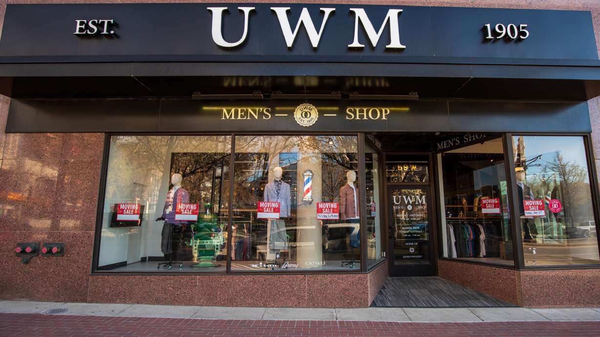 Signs promoting a "closing sale" are posted UWM Men's Shop in downtown Salt Lake City Monday. The b...