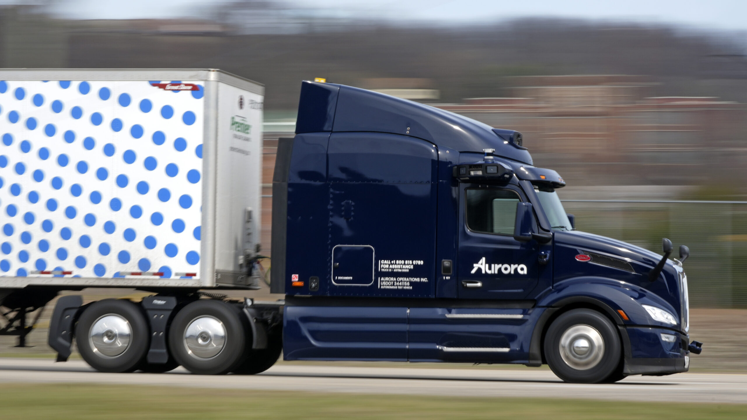 A self-driving tractor trailer maneuvers around a test track in Pittsburgh, Thursday, March 14, 202...