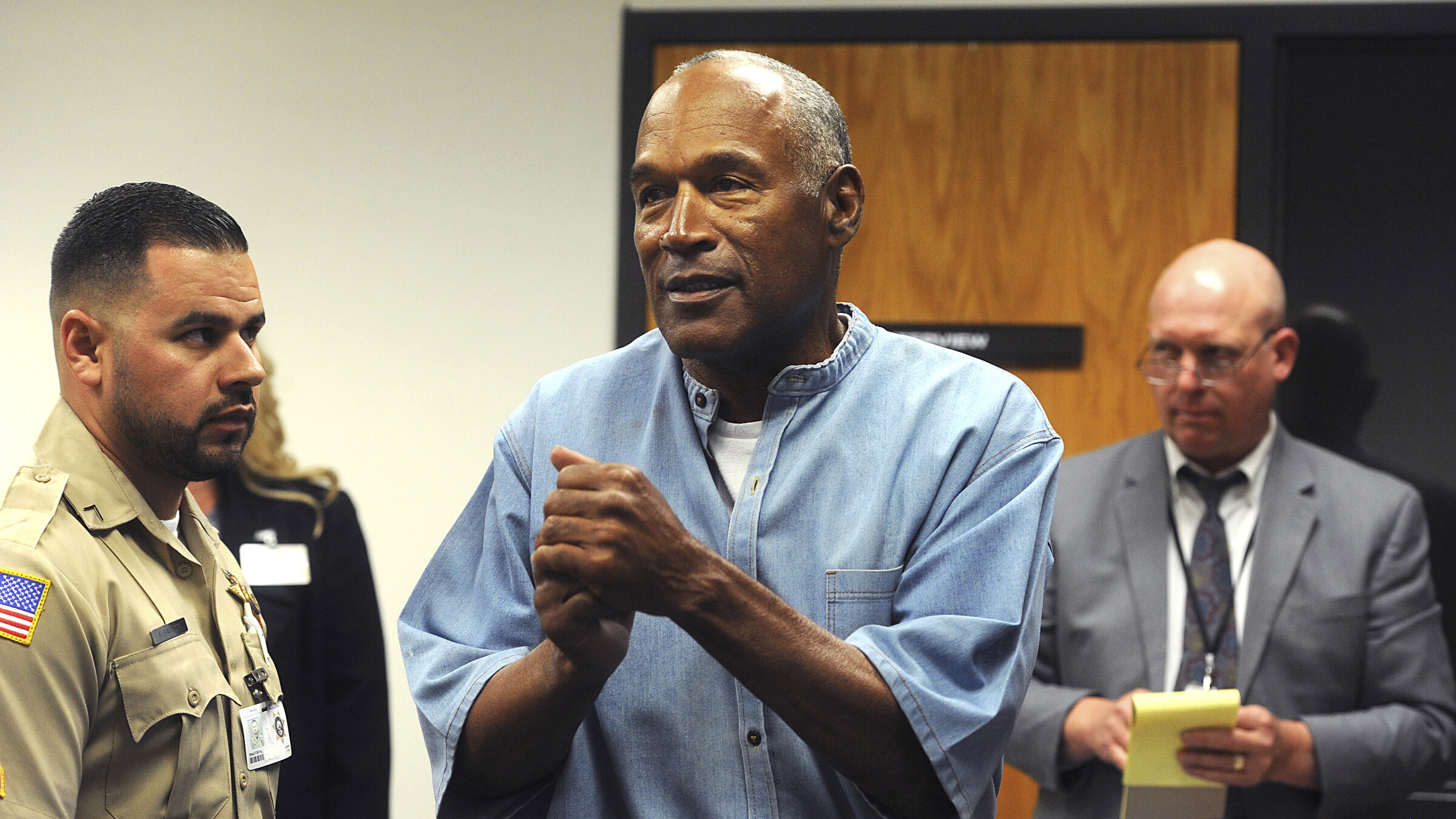 FILE - In this July 20, 2017 file photo, former NFL football star O.J. Simpson reacts after learnin...