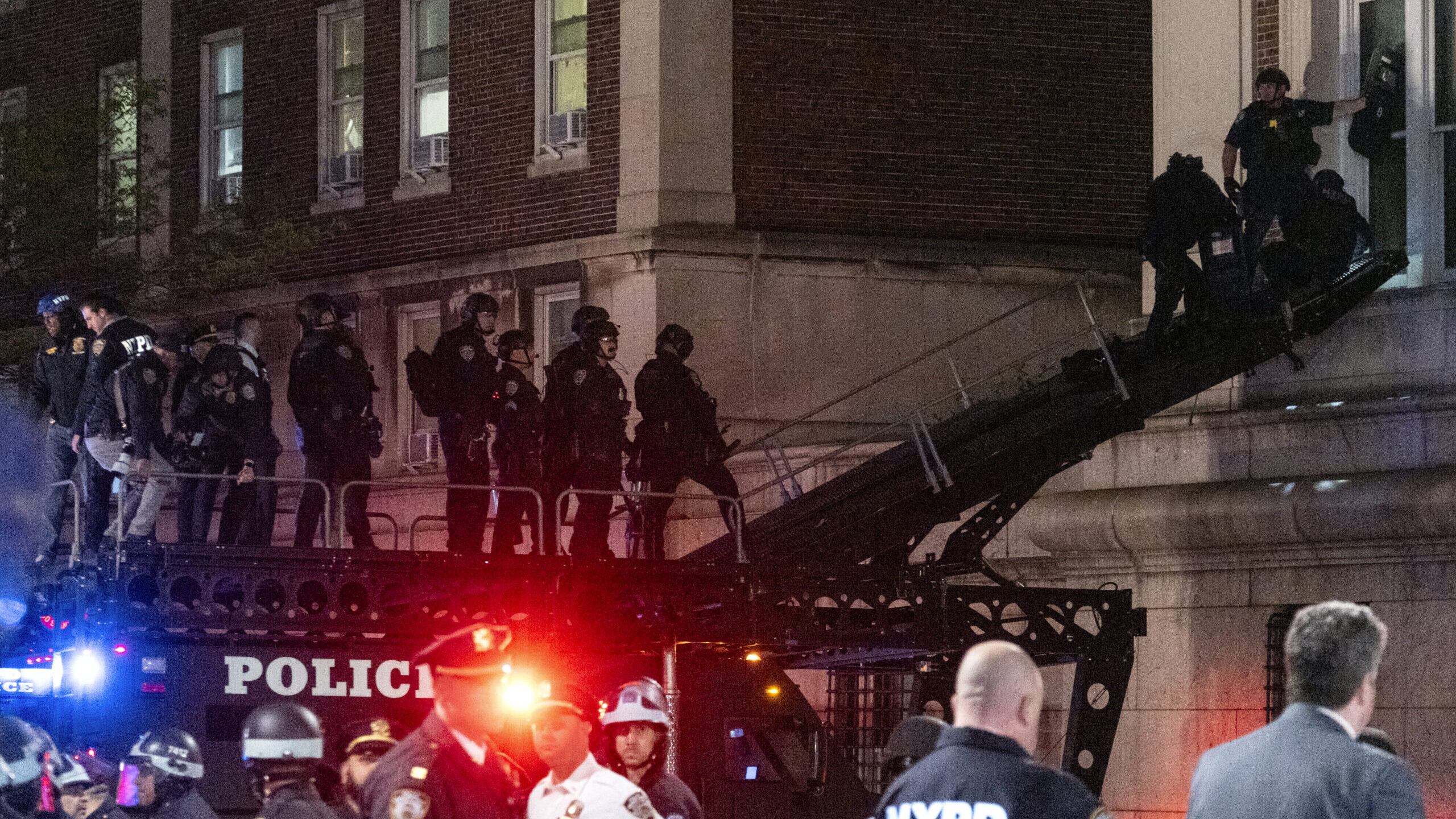 Using a tactical vehicle, New York City police enter an upper floor of Hamilton Hall on the Columbi...