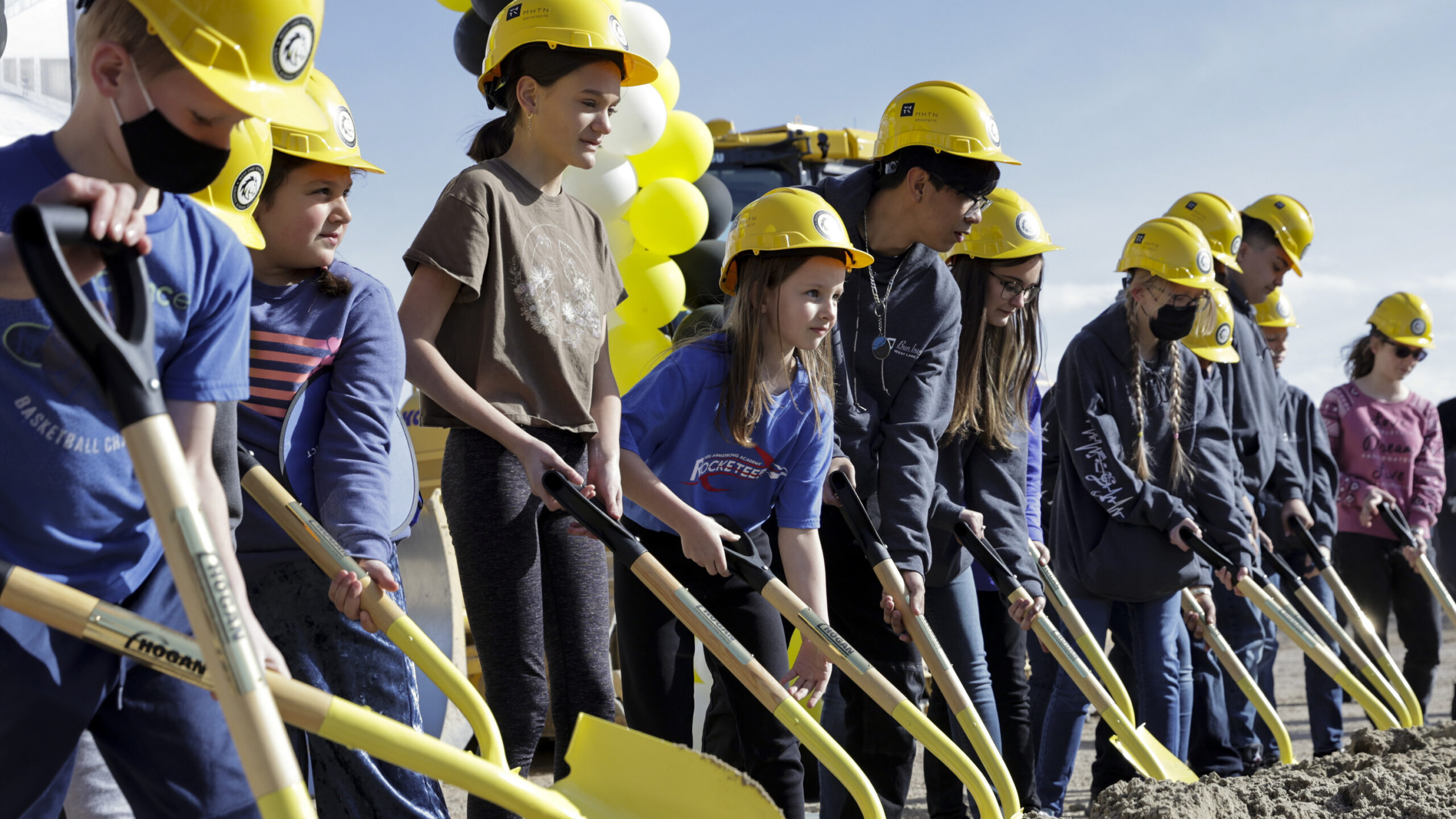 Students participate in the groundbreaking ceremony for the new West Lake Jr. High building in 2022...