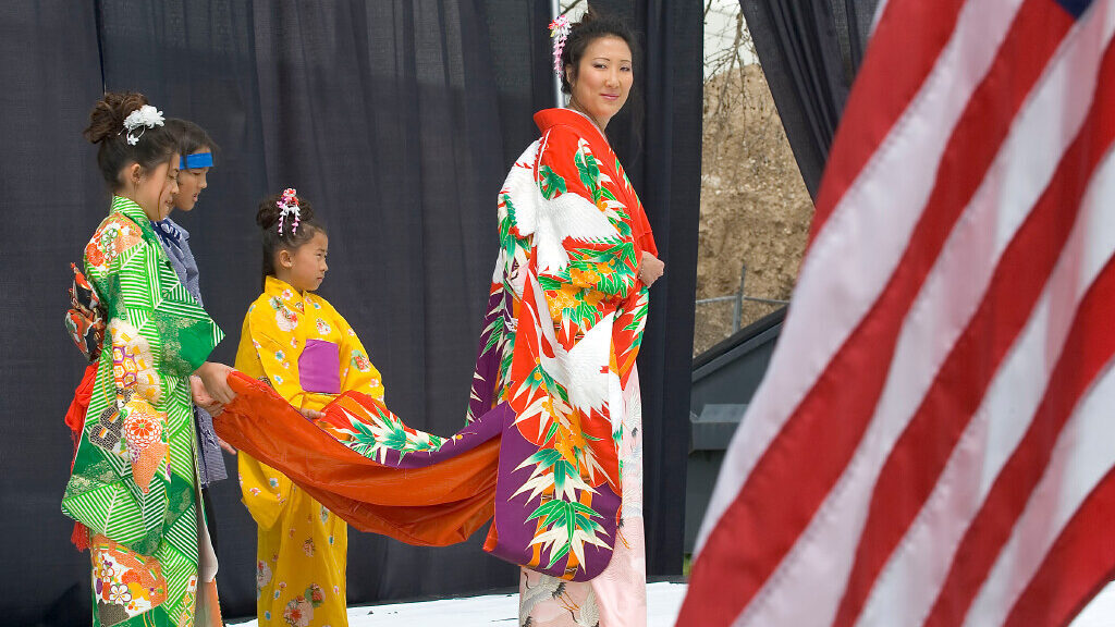 Cheryl Mori with her kimono held by (from left) Kayla Wantanabe, Garrett Atkinson and Monet Wantana...