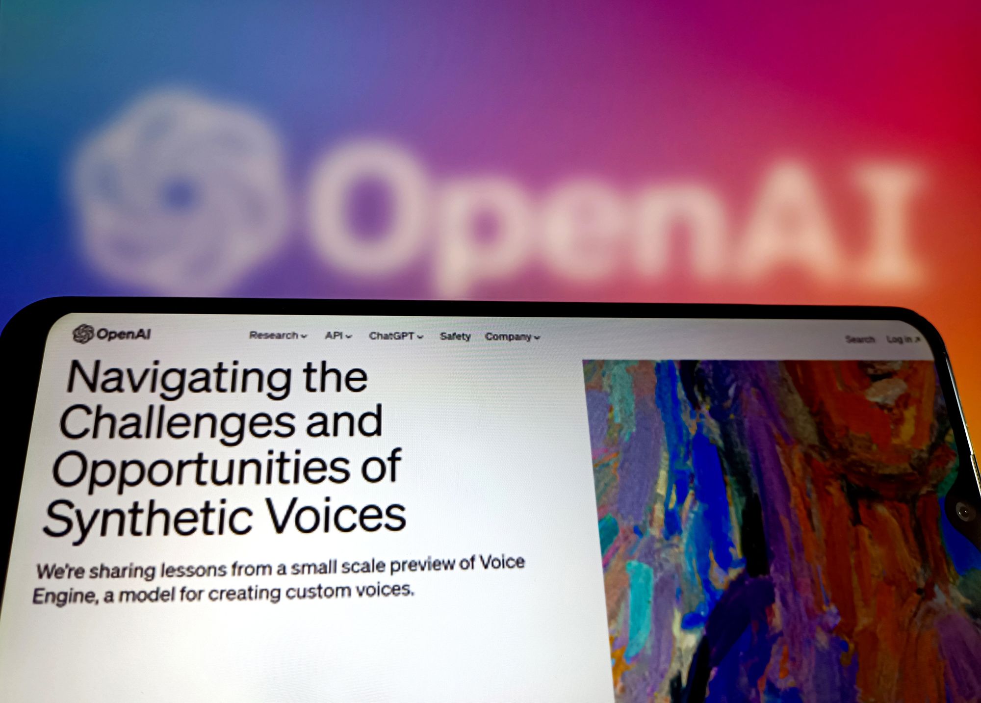 a laptop shows openai voice engine blog post...