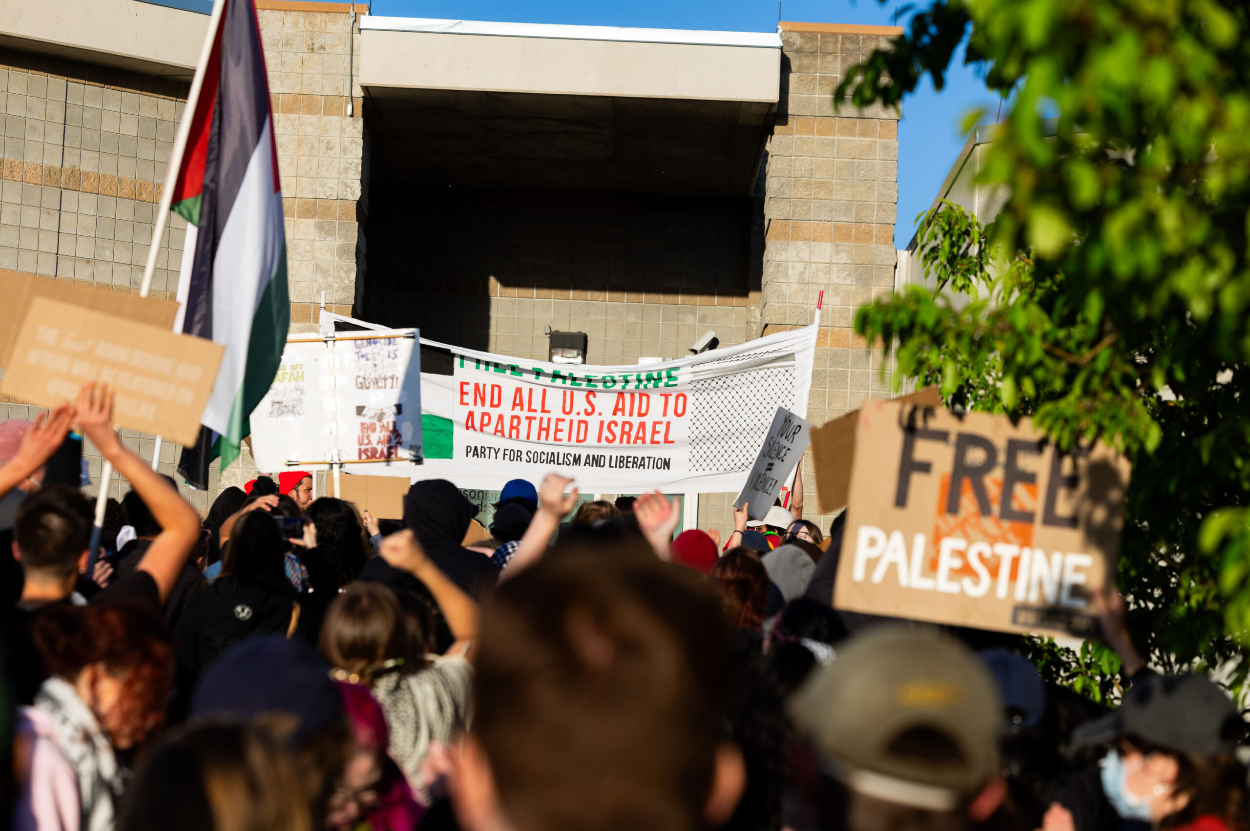 Demonstrators walk up the steps as they gather in support of Palestine and to defend the right for ...