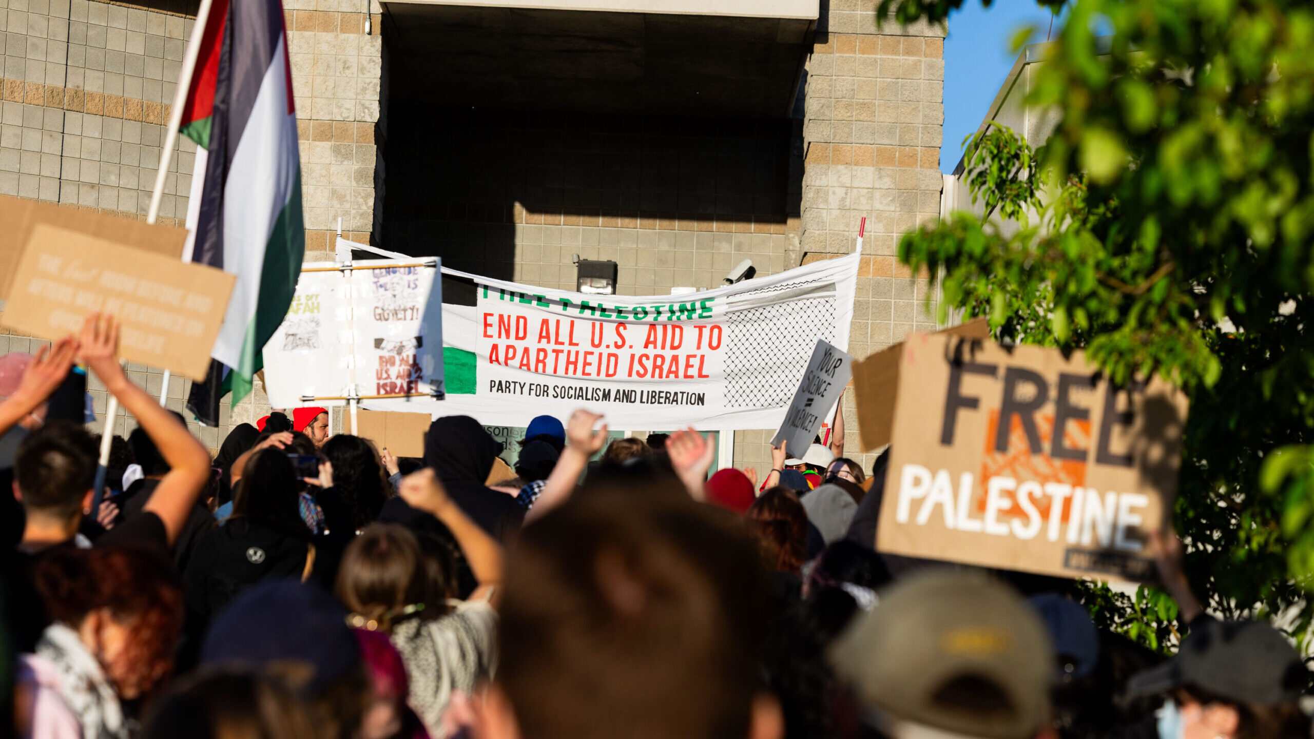 Demonstrators walk up the steps as they gather in support of Palestine and to defend the right for ...