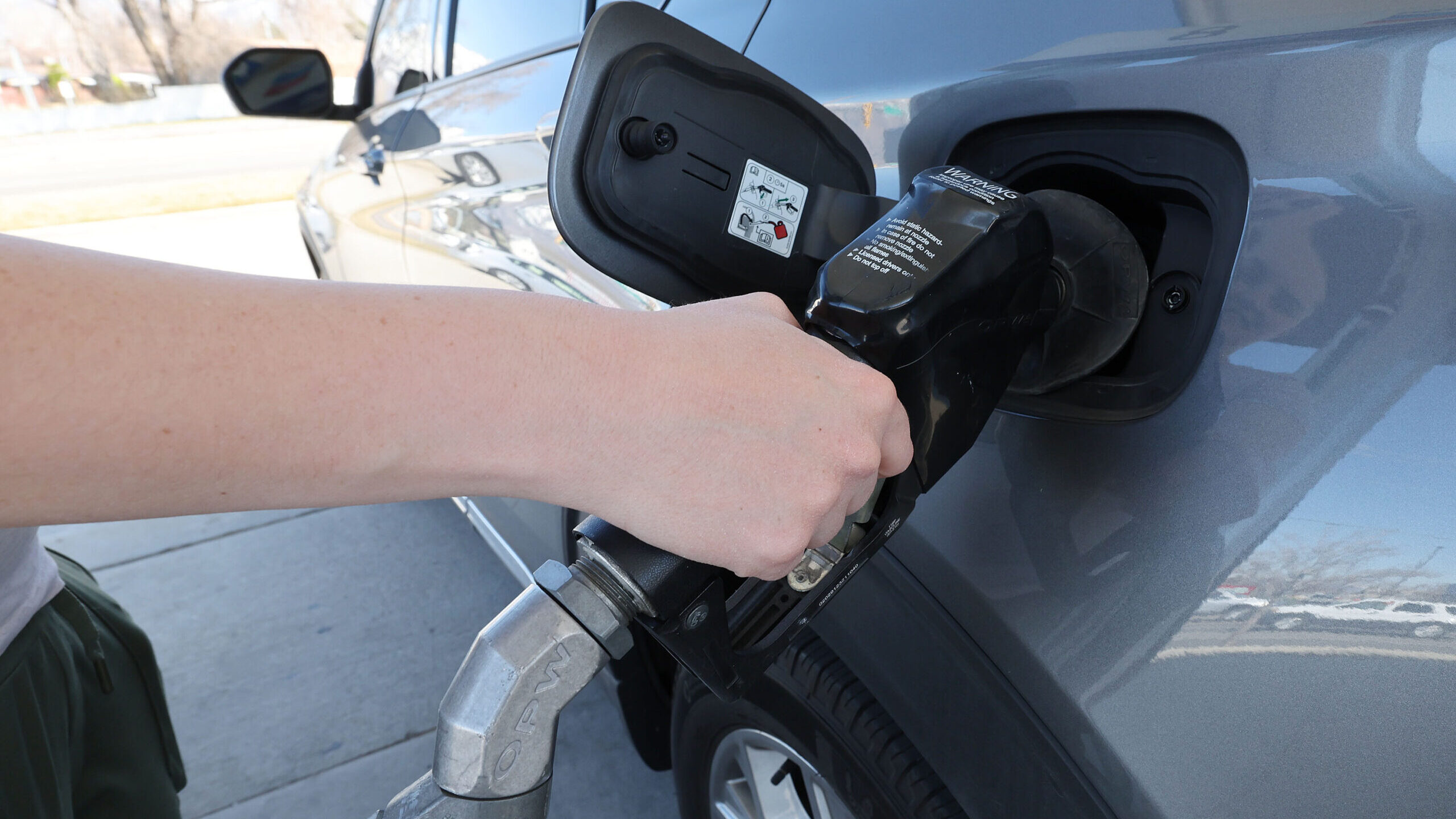 A car is filled at a gas pump in Sandy on Tuesday, March 19, 2024. Utah gas prices are currently be...