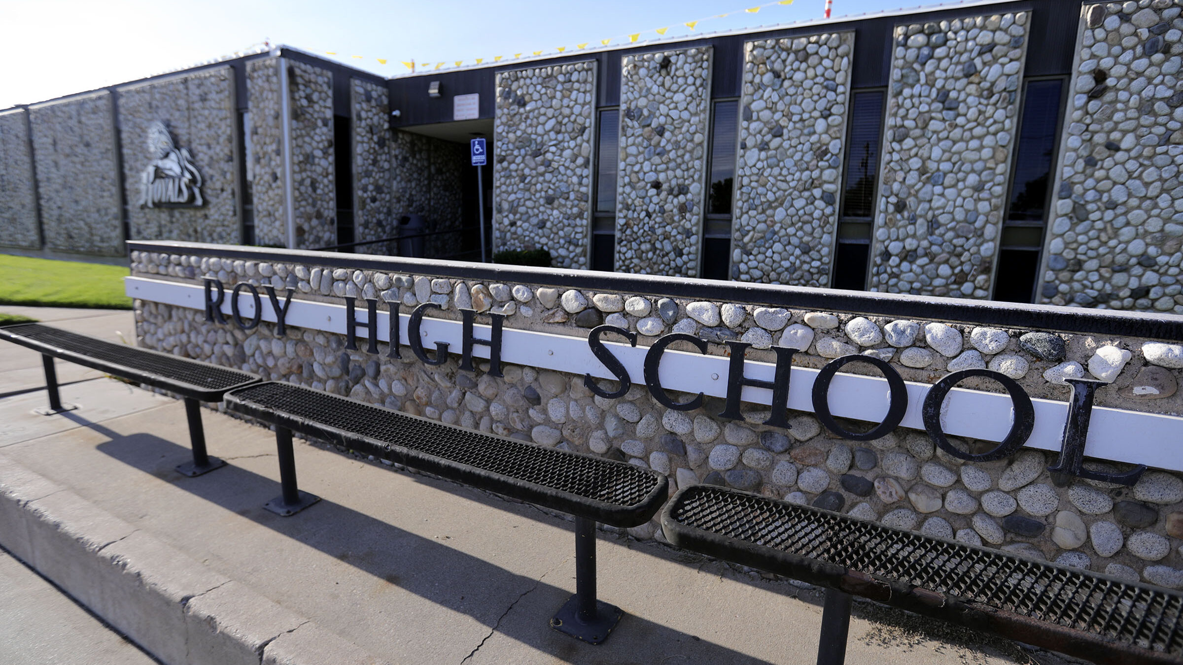Roy High School sign pictured, a student allegedly brought a gun to campus...